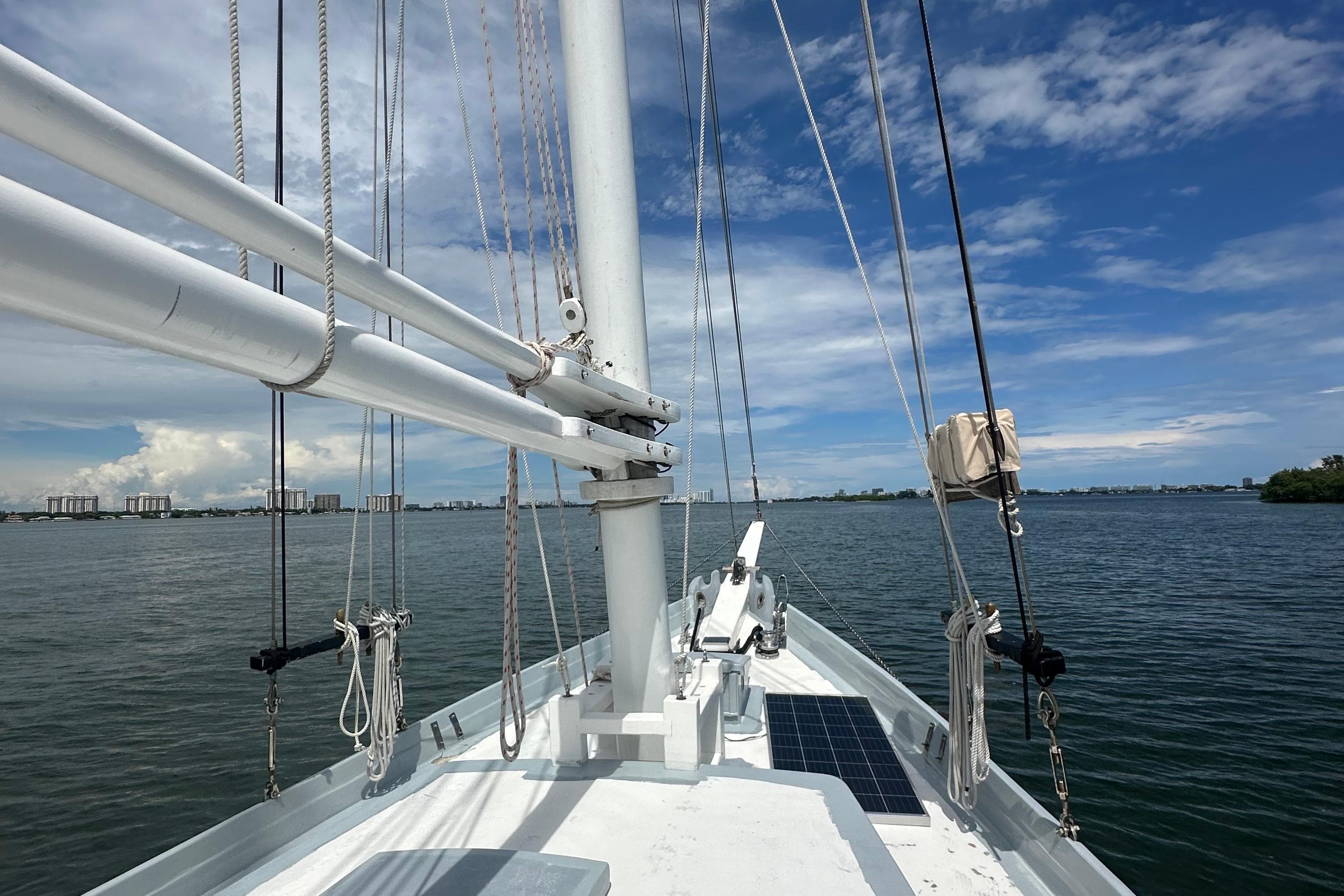 Schooner Leopard 1994 sailing on calm waters under a clear blue sky.