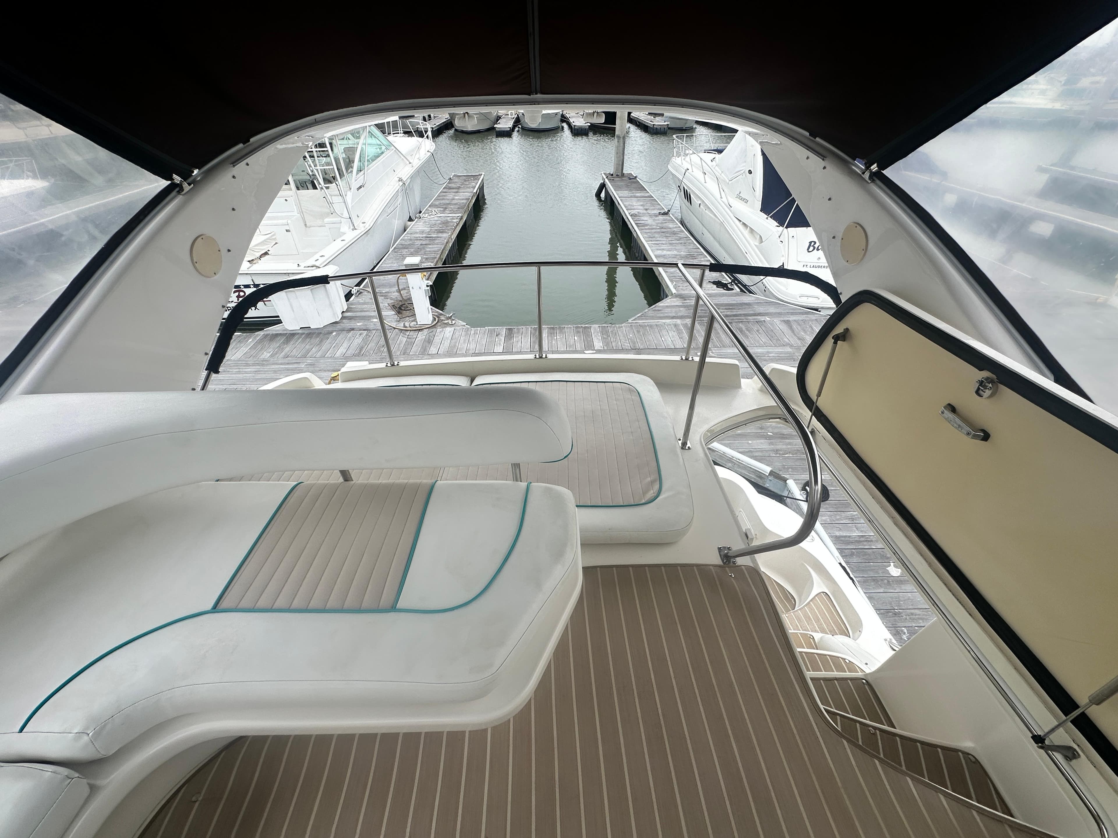 1997 Sea Ray 400 Sedan Bridge yacht interior with marina view.