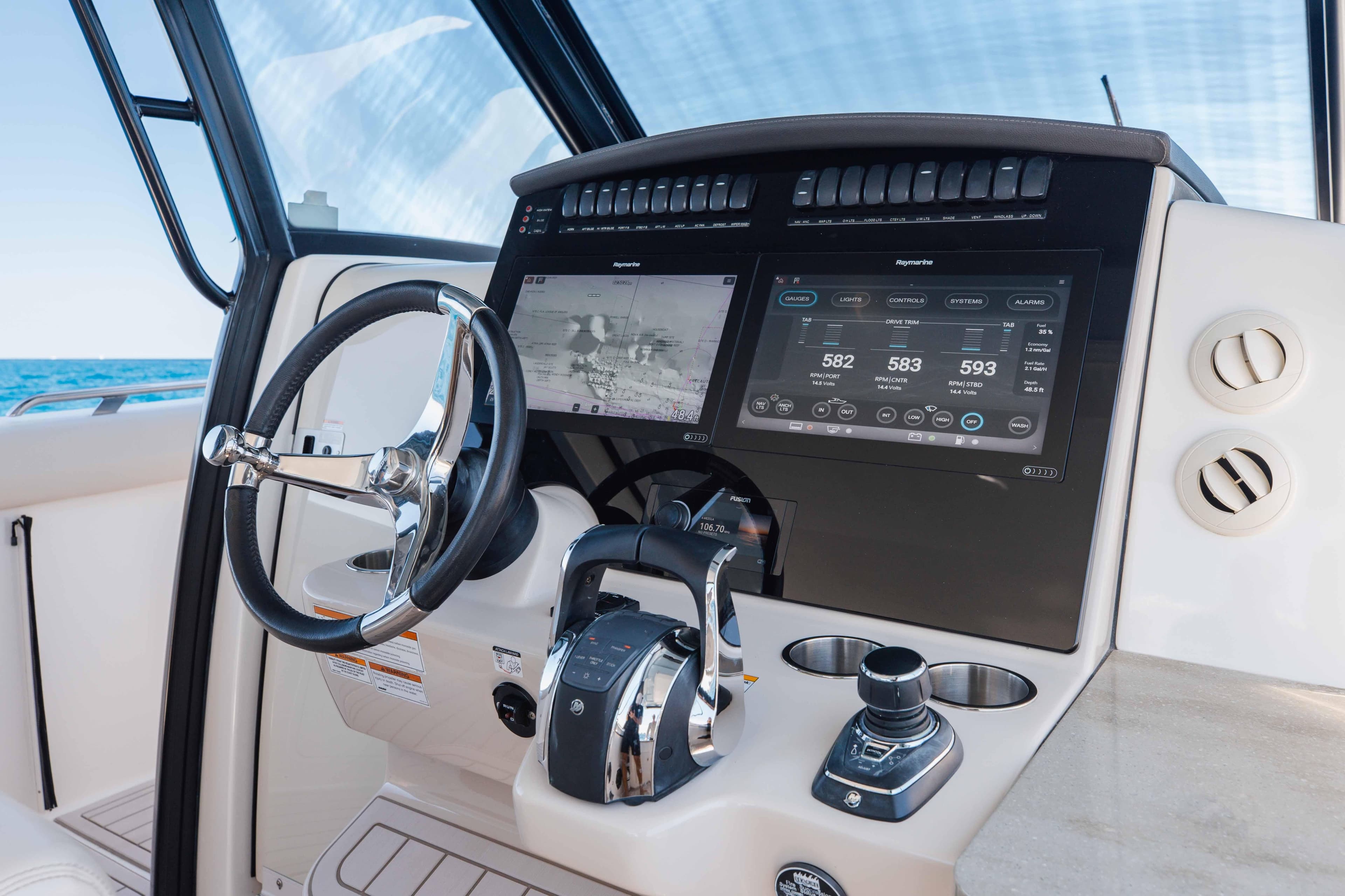 2021 Boston Whaler 350 Realm helm with advanced navigation displays and controls.