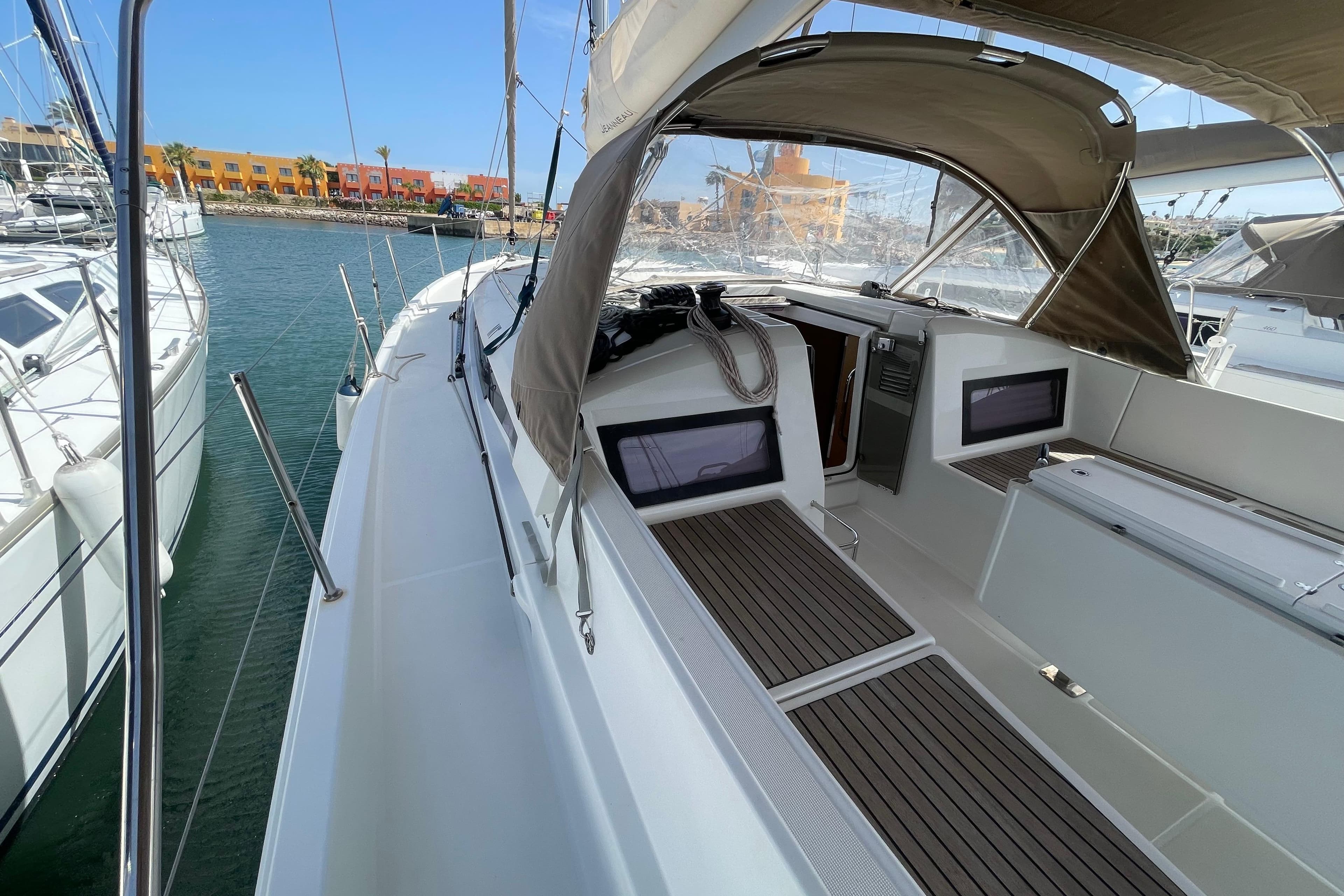 2018 Jeanneau Sun Odyssey 440 sailboat docked, featuring spacious deck and modern design.