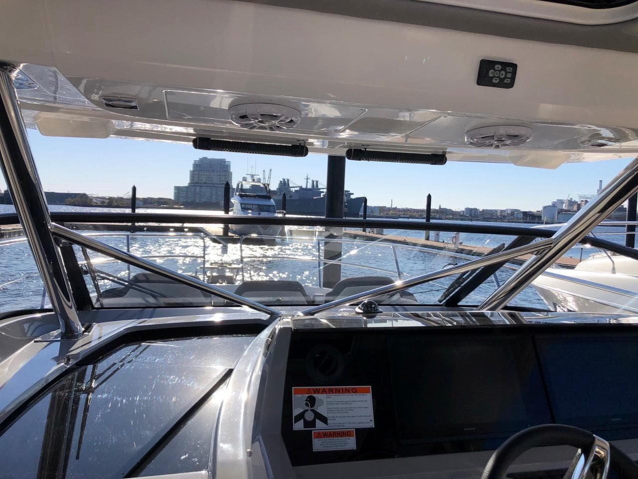 2024 Jeanneau Leader 12.5 WA boat interior with waterfront view.