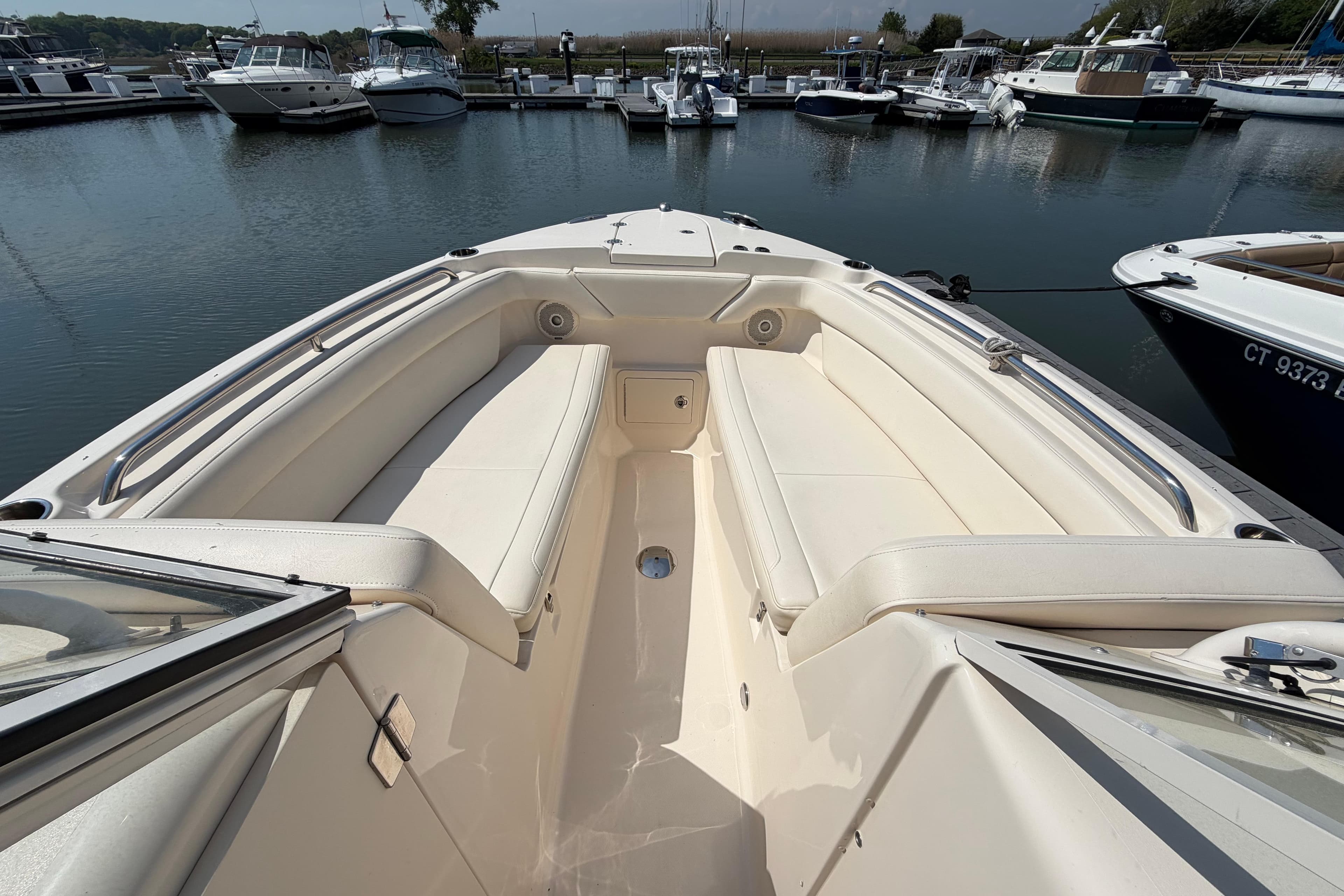 2018 Grady-White Freedom 275 boat interior with spacious seating at marina.