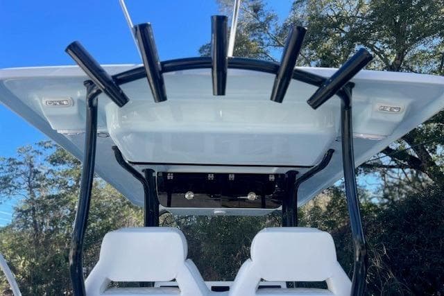 Key West 263 FS 2026 boat with rod holders and seats.