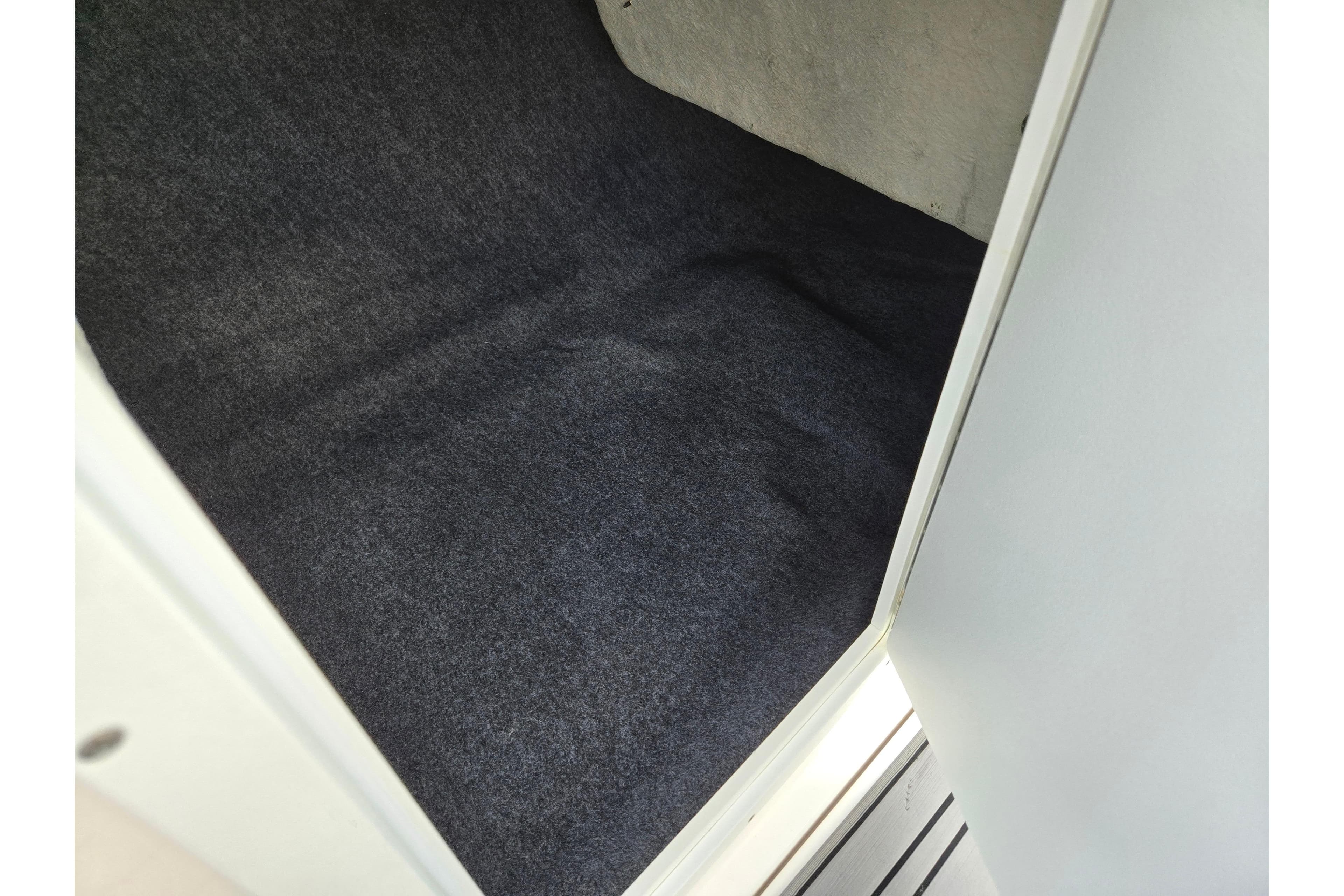 Carpeted storage compartment in 2018 Yamaha Boats 212X.