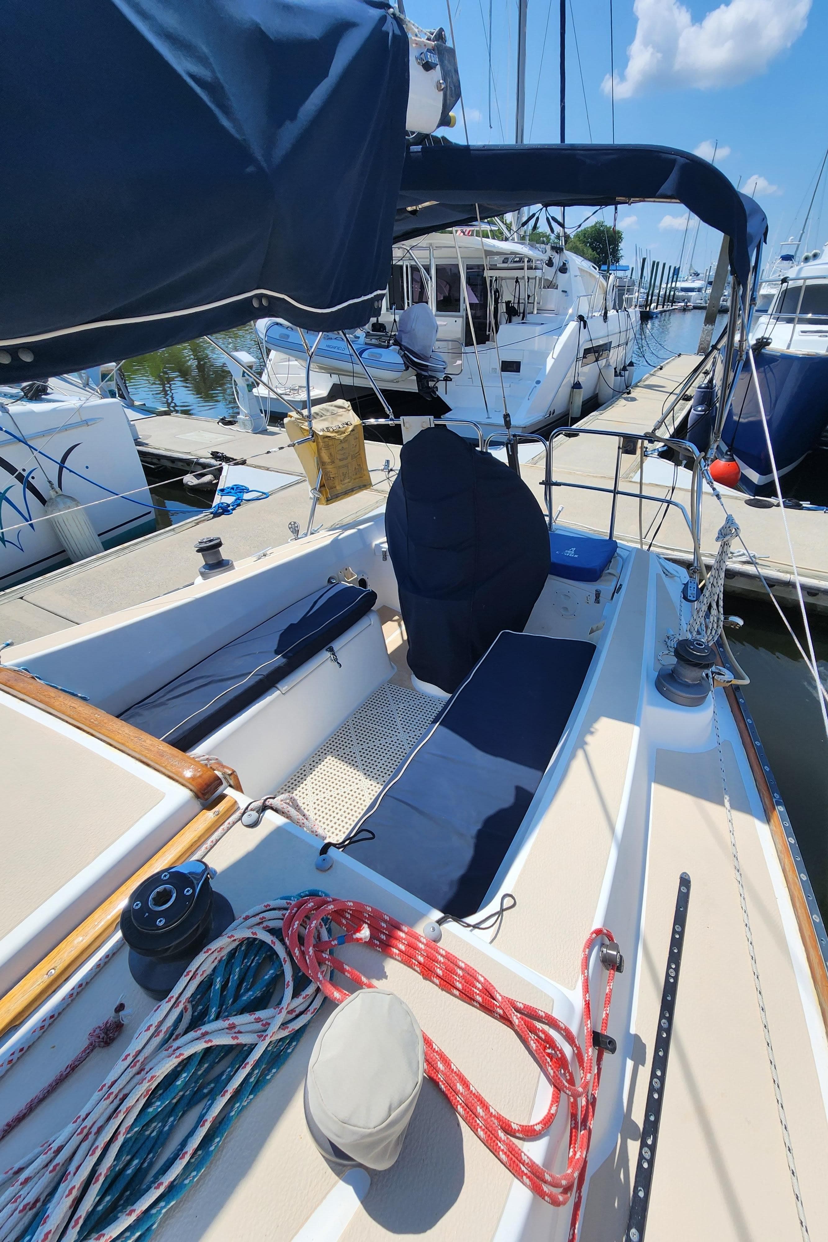 1986 Tartan 34-2 sailboat docked, featuring deck and rigging details.