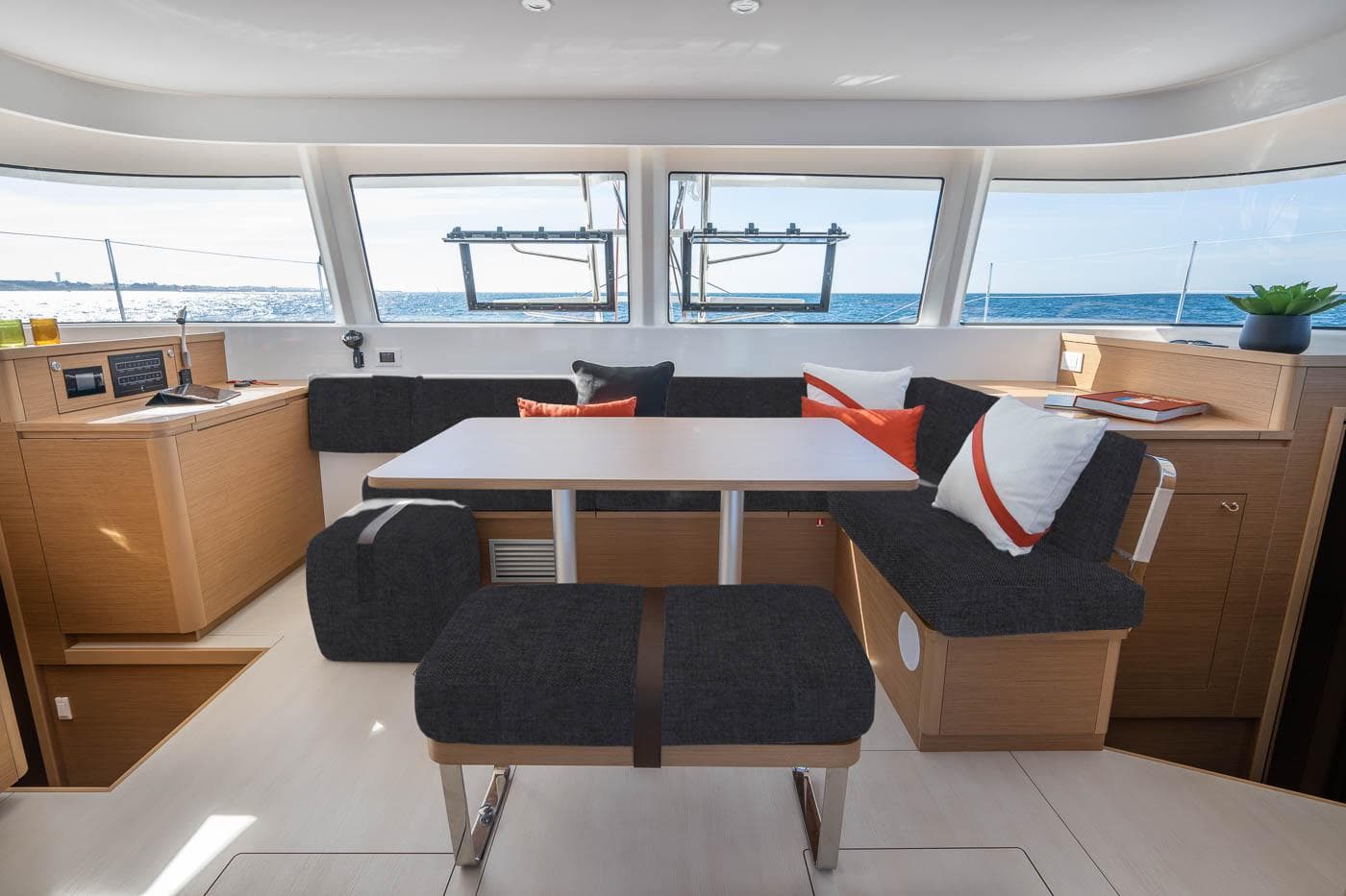Manufacturer Provided Image: Luxurious interior of 2026 Excess 14 catamaran with modern seating and ocean view.