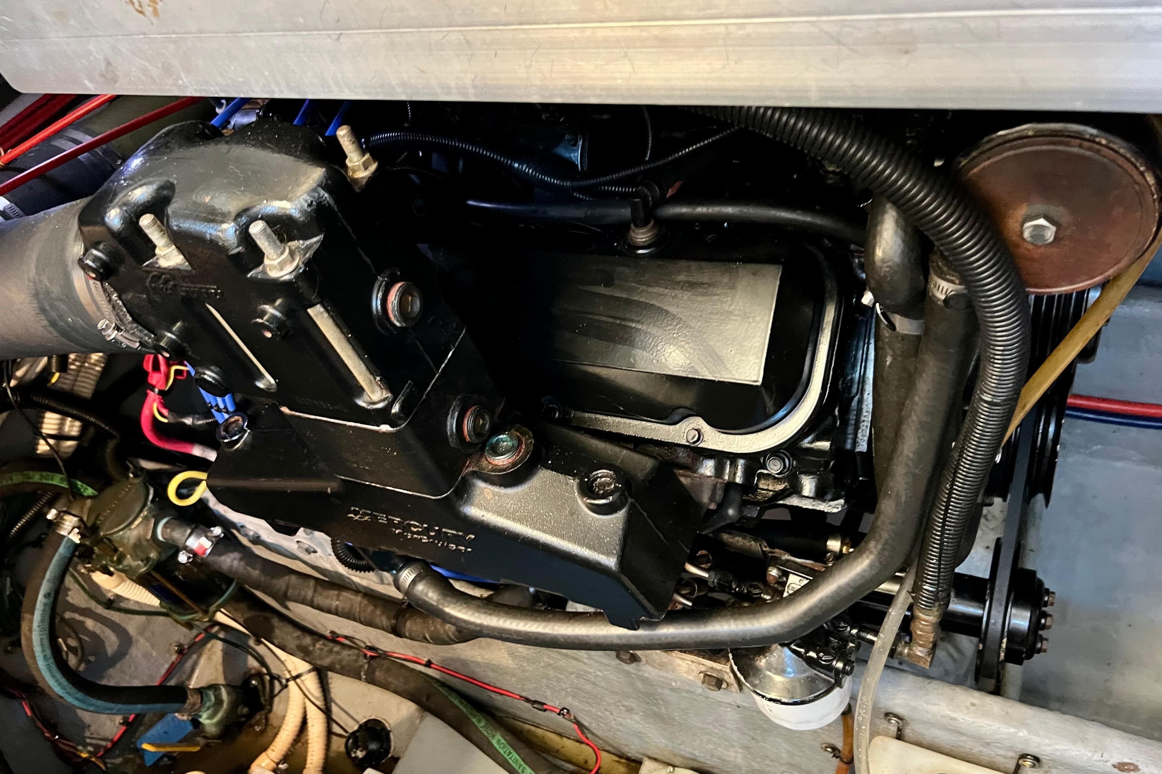Engine compartment of a 1997 Sea Ray 370 Aft Cabin boat, showing detailed components.