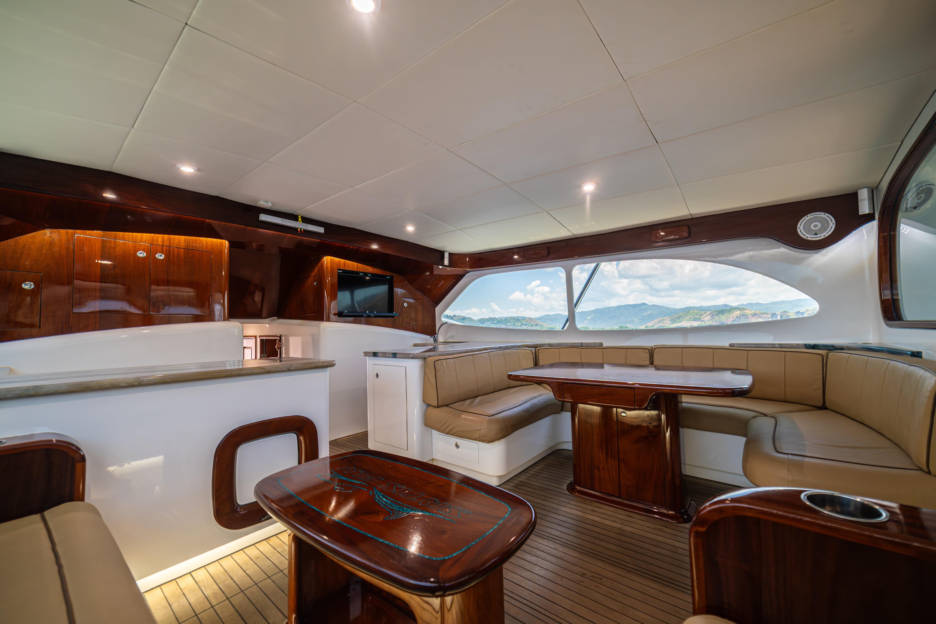 Luxurious interior of 2020 Maverick Yachts Costa Rica 50 Sportfish with elegant seating and panoramic windows.