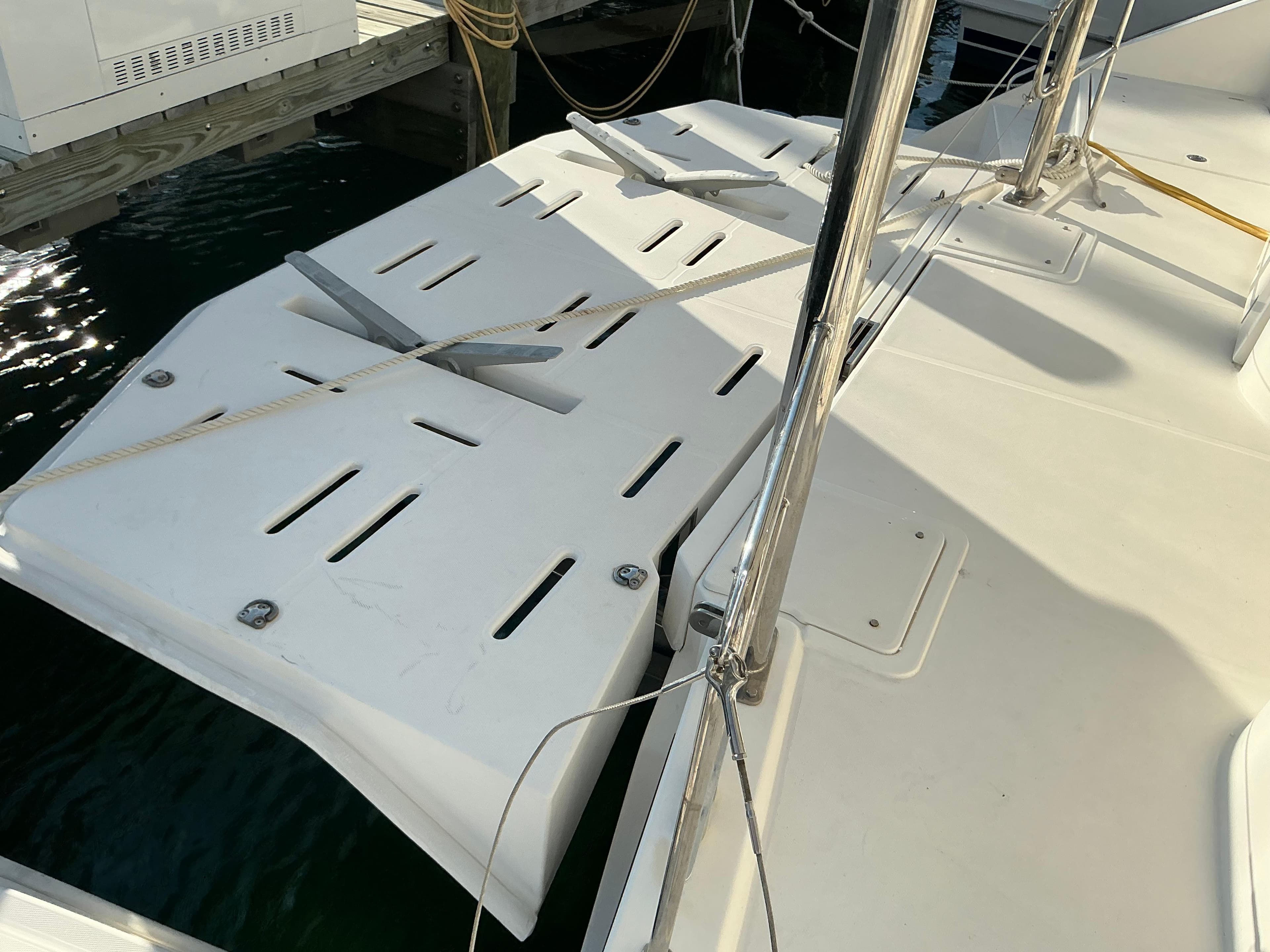 2019 Leopard 51 Powercat deck with mooring ropes and water reflection.