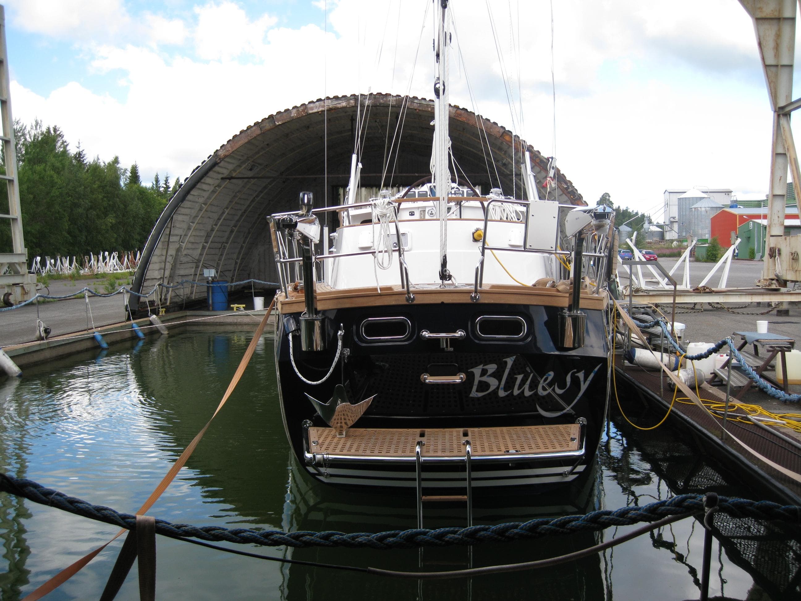 Nauticat 441 sailboat docked in a marina, rear view, 2017 model.