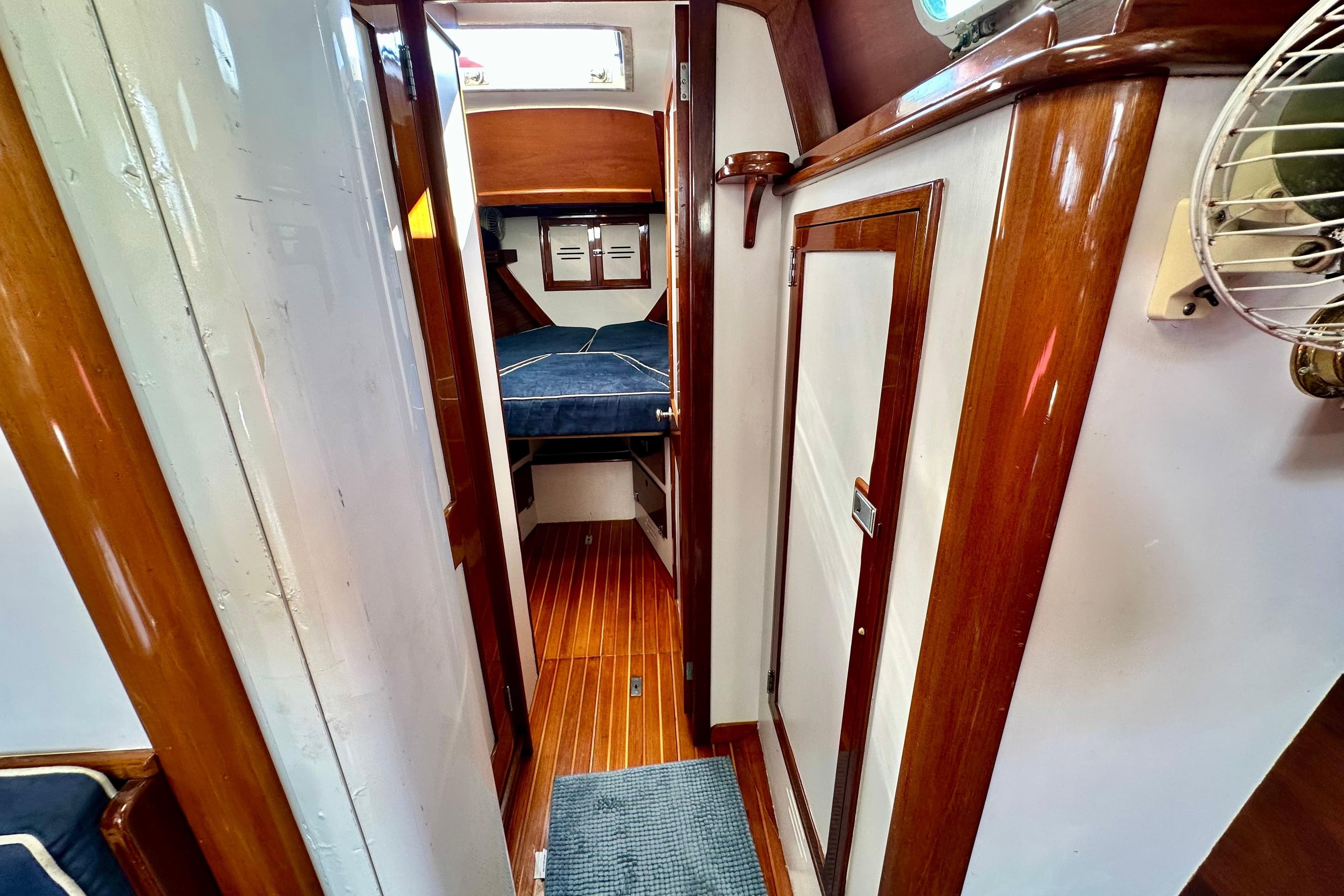 Interior of 1982 Hinckley Bermuda 40 MK III sailboat with wooden finishes and cozy cabin.