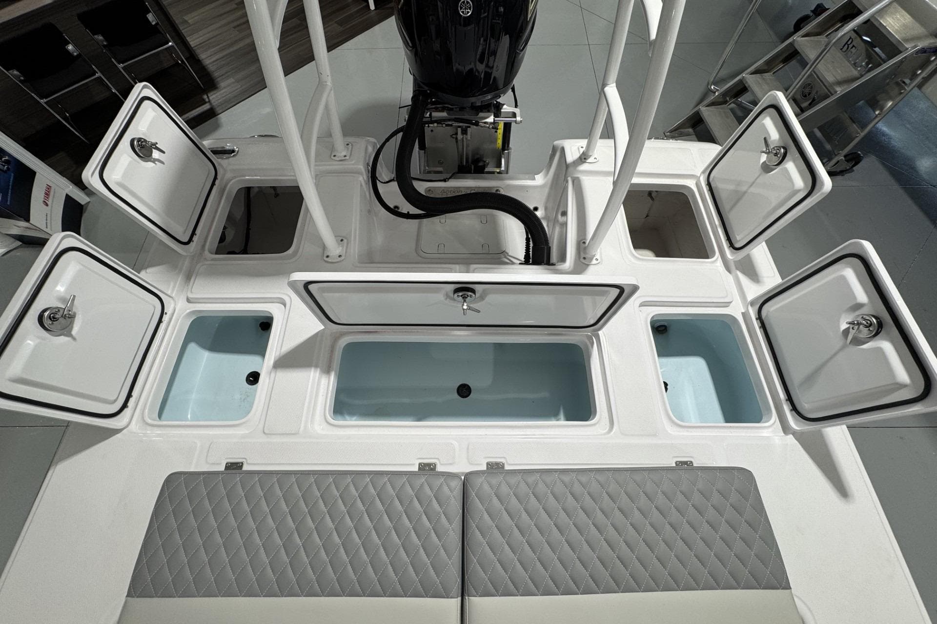 2026 Action Craft 20 Flatsmaster boat with open storage compartments and seating.