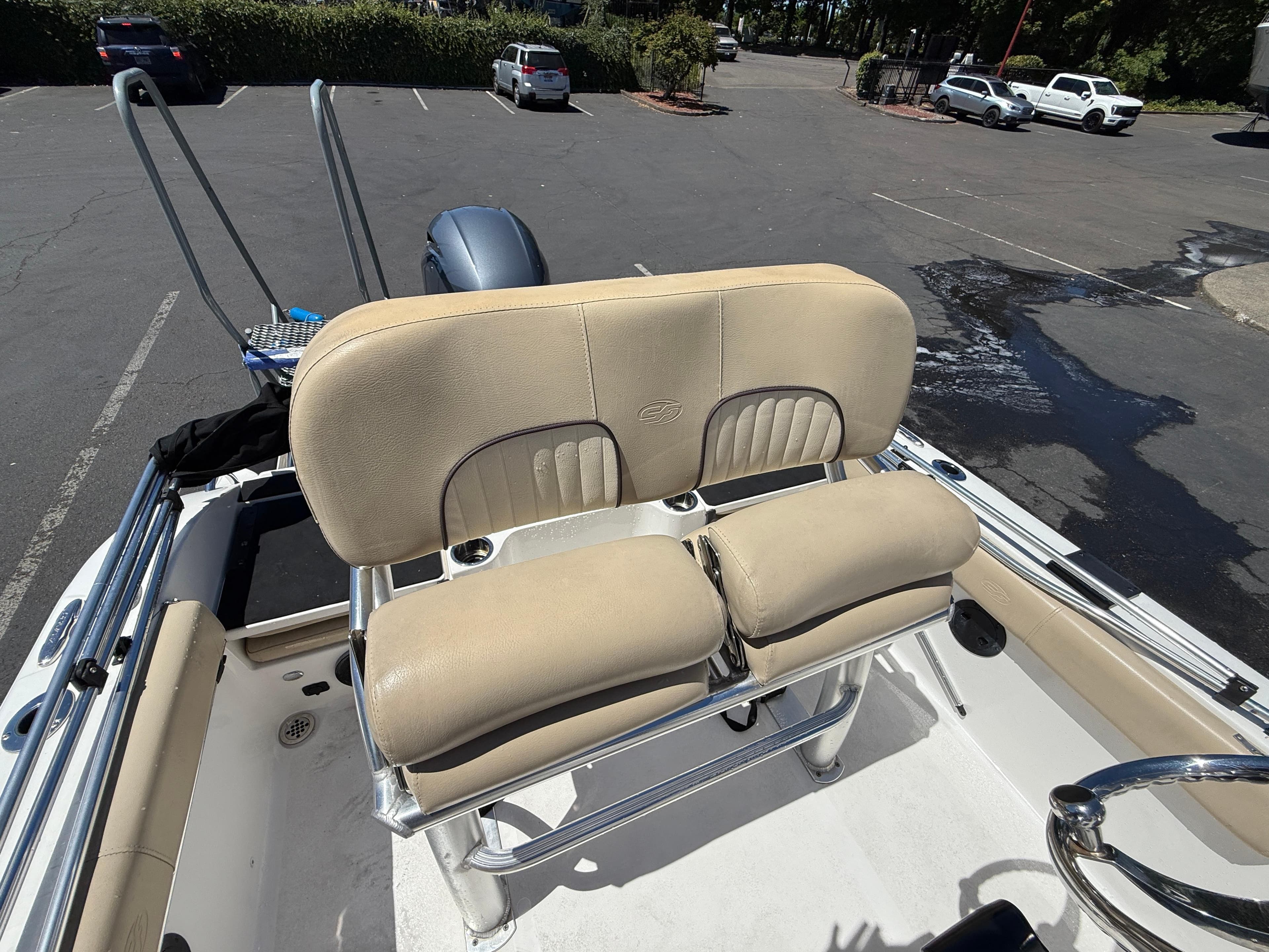 2018 Sea Fox 186 Commander boat with beige seating in a parking lot.