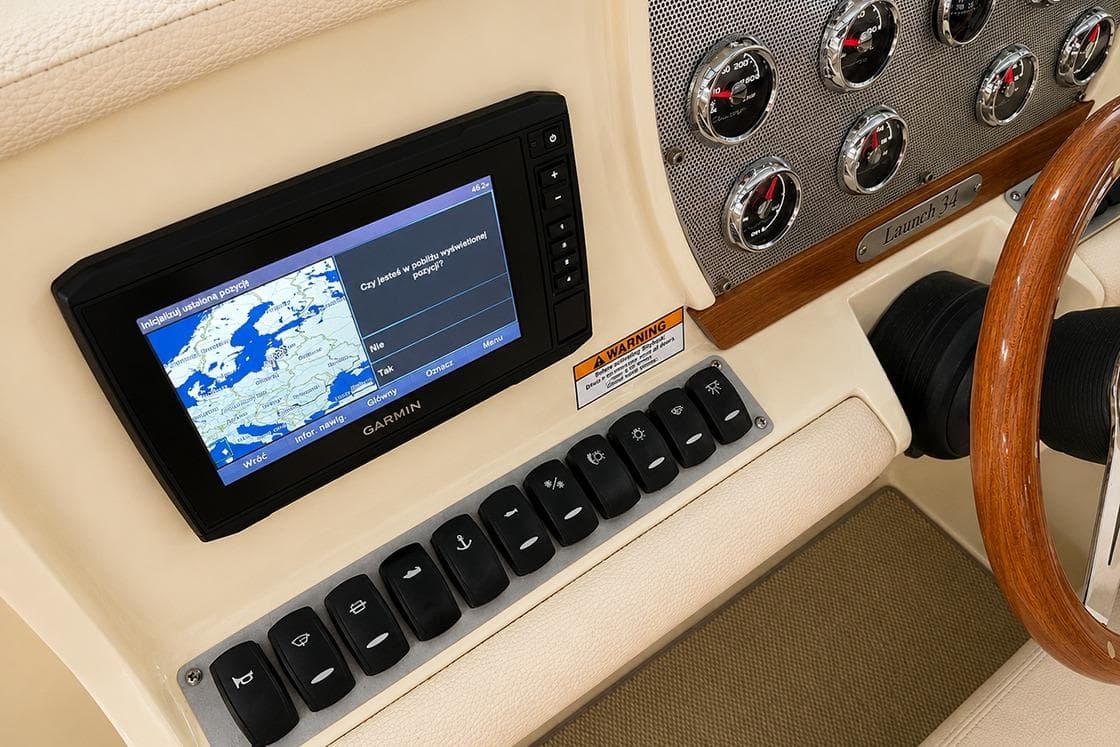 2018 Chris-Craft Launch 34 dashboard with Garmin GPS and control switches.