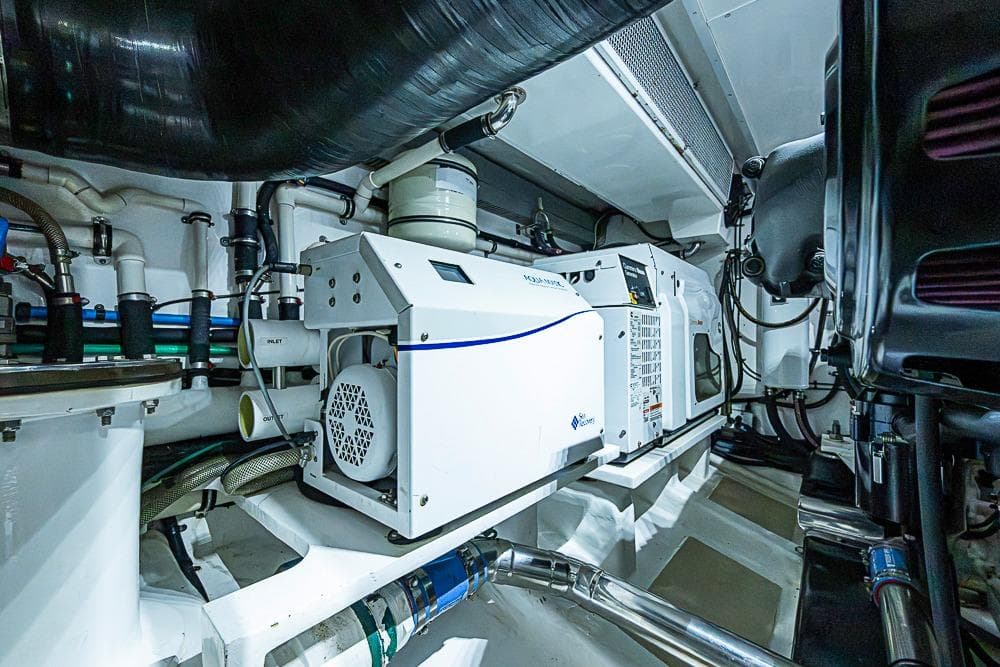 Engine room of 2014 Marlow Explorer 66E yacht, showcasing advanced machinery and equipment.