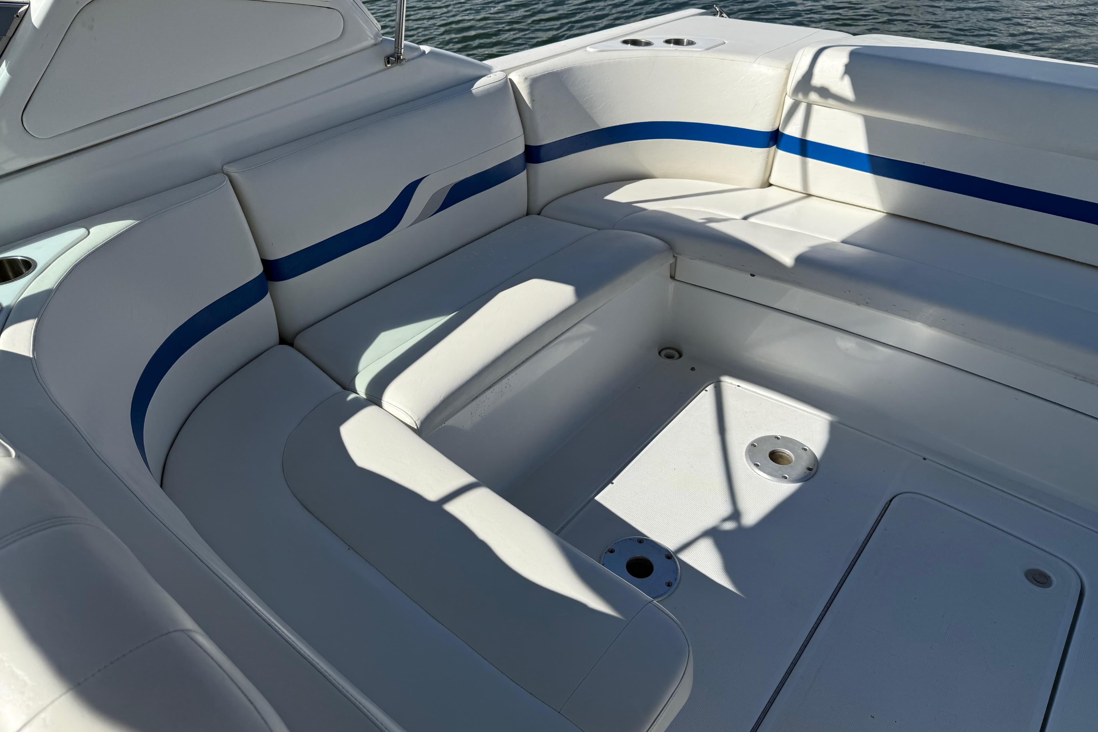 2004 Formula 330 Sun Sport boat interior with white and blue seating.