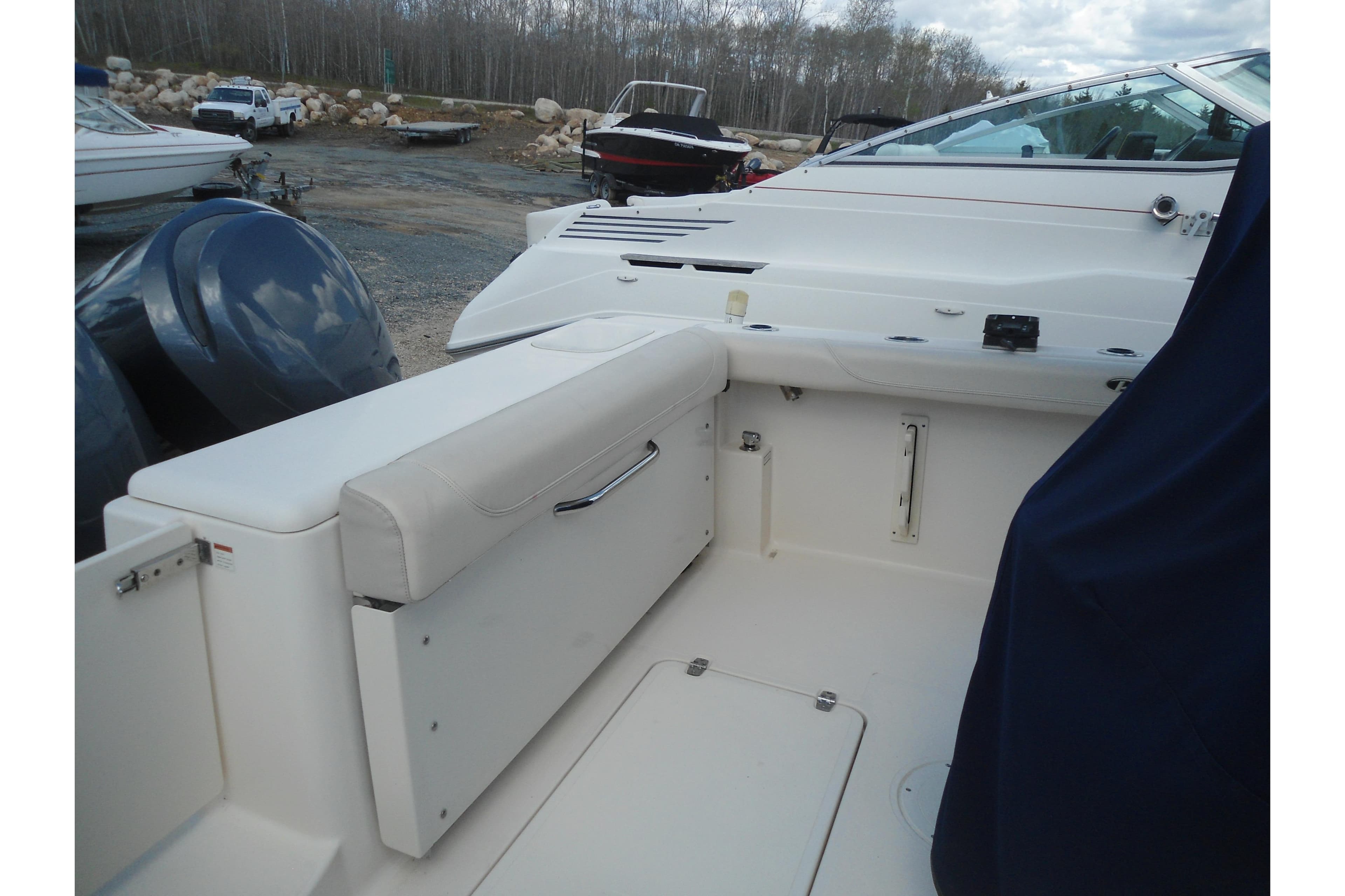 2013 Pursuit C 260 Center Console boat interior with seating and storage.