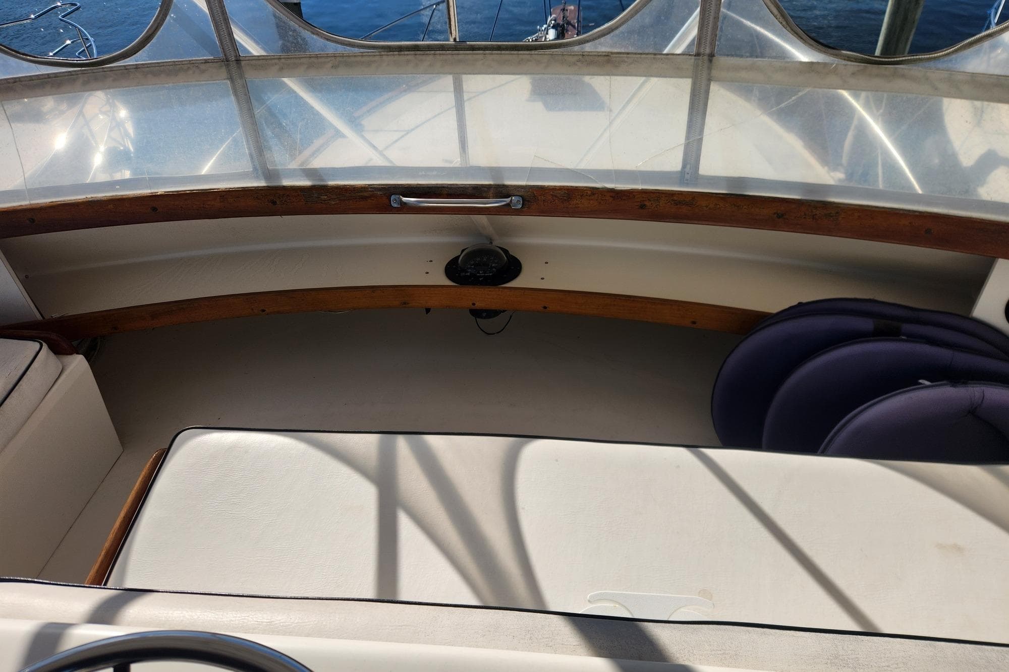 1977 Post Sport Fish boat interior with seating and wooden accents.