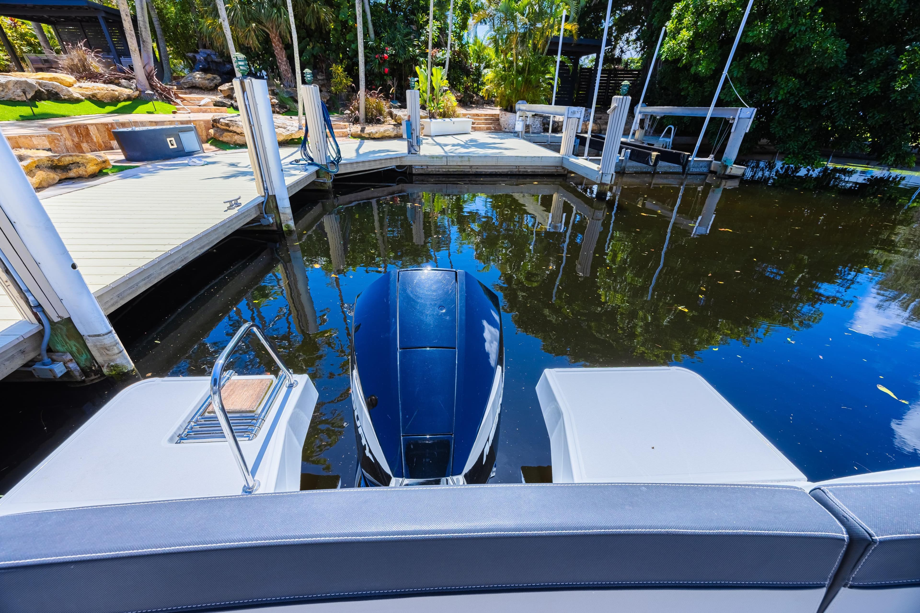 2022 Jeanneau NC 795 Series 2 docked in a serene marina setting.
