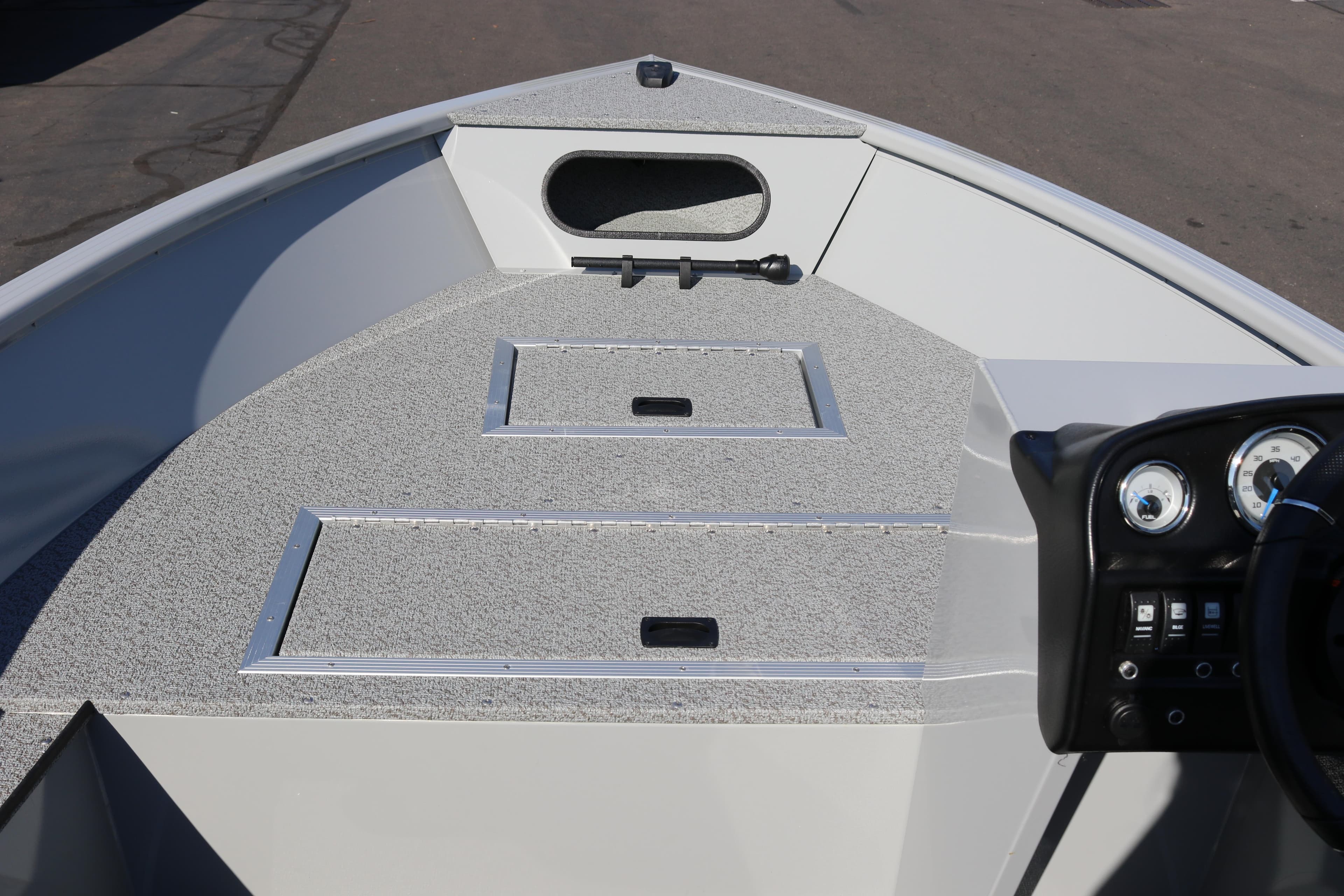 2025 Smoker Craft Pro Lodge 160 boat interior with dashboard and storage compartments.