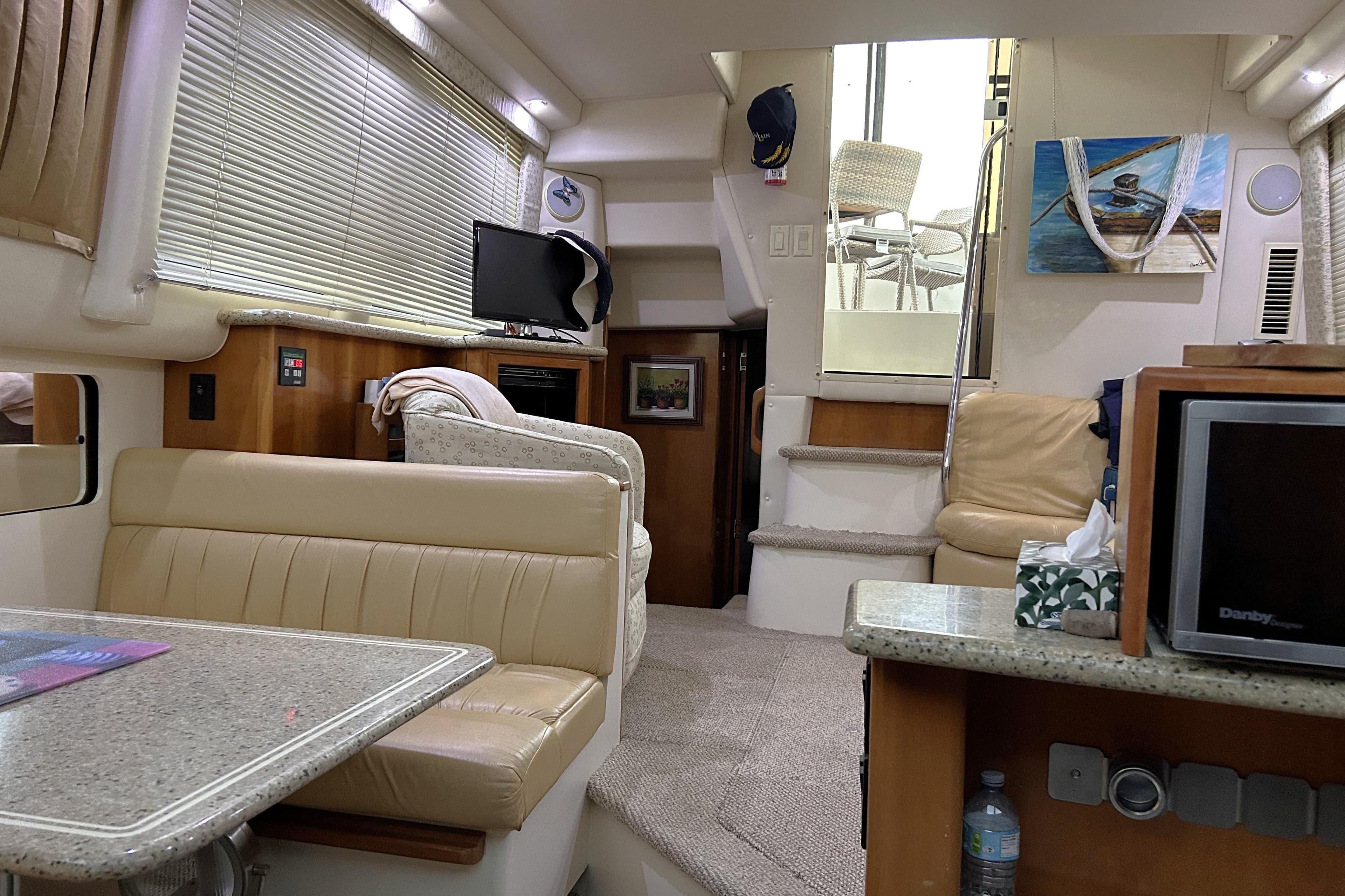 Interior of 2001 Carver 356 Motor Yacht with cozy seating and modern amenities.