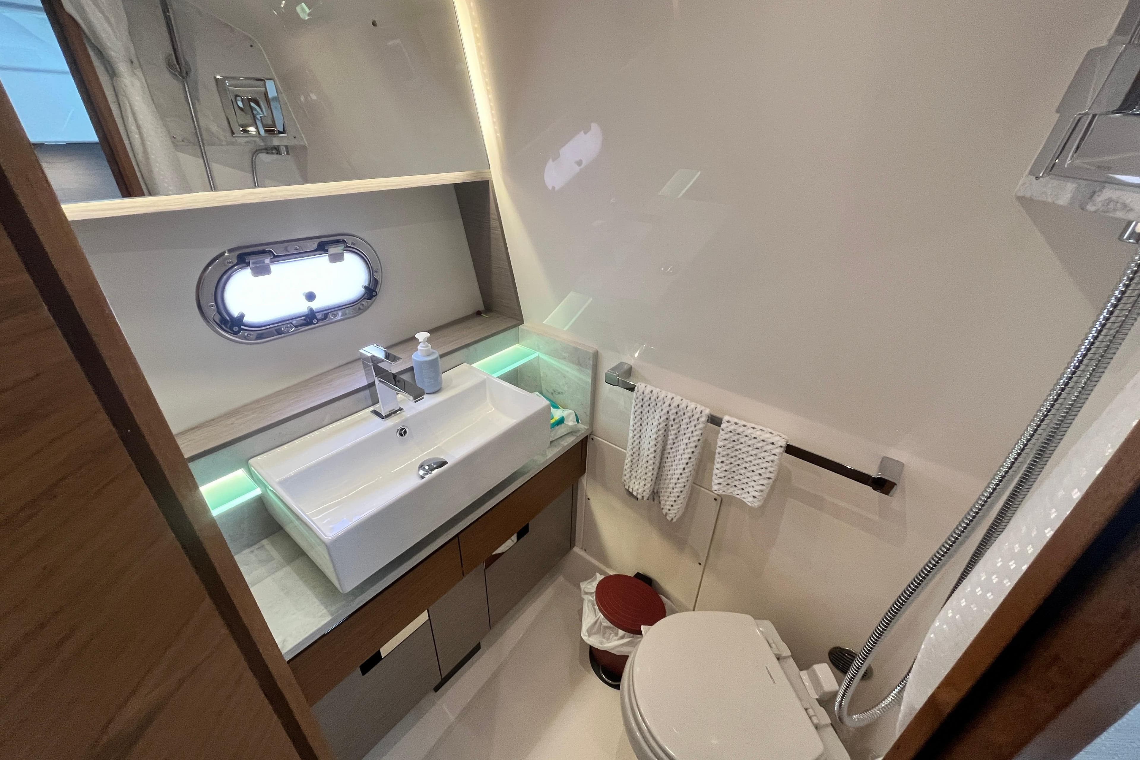 Luxurious bathroom in 2023 Tiara Yachts 43 LS, featuring modern sink and elegant fixtures.