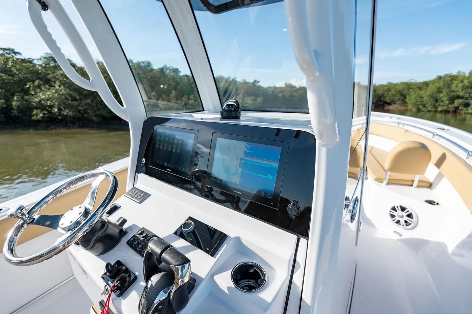 Manufacturer Provided Image: 2025 Sportsman Open 252 Center Console boat interior with modern dashboard and steering wheel.