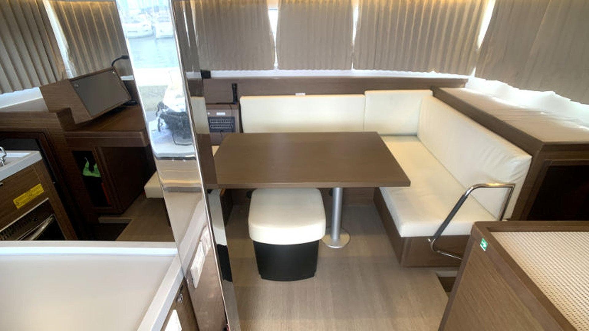 Interior of 2019 Lagoon 40 catamaran with modern dining area and seating.