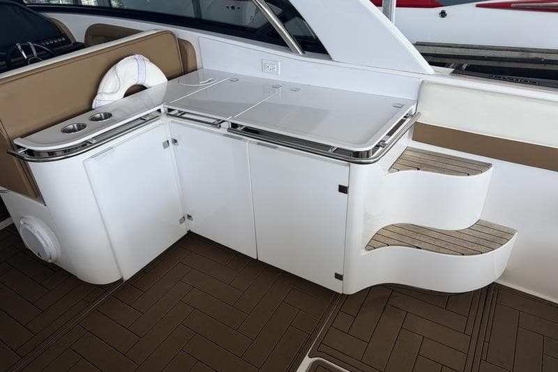 2015 Cobalt A40 yacht interior with sleek cabinetry and wooden steps.