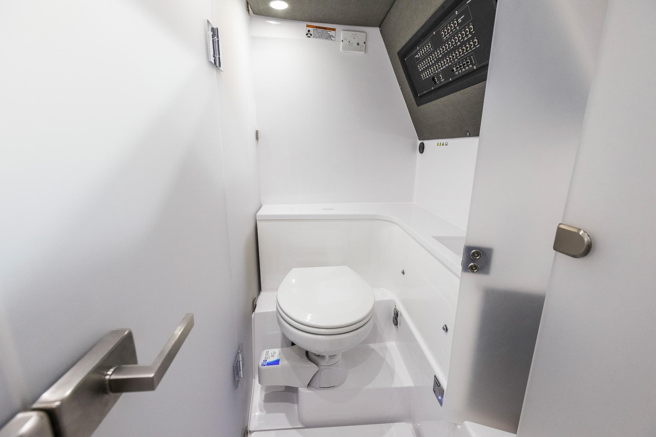Interior of 2021 Axopar 37 XC Cross Cabin bathroom with modern fixtures.