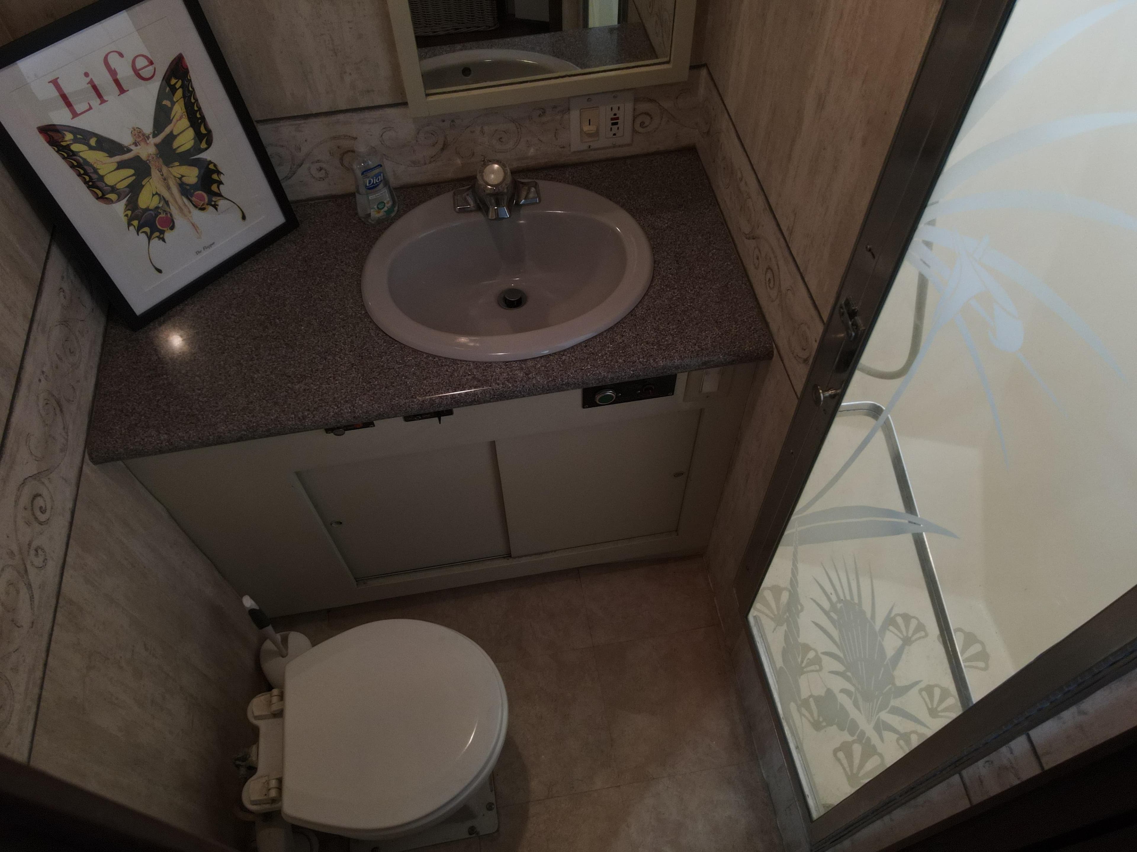 1979 Hatteras 58 Cockpit Motor Yacht bathroom with sink and toilet.