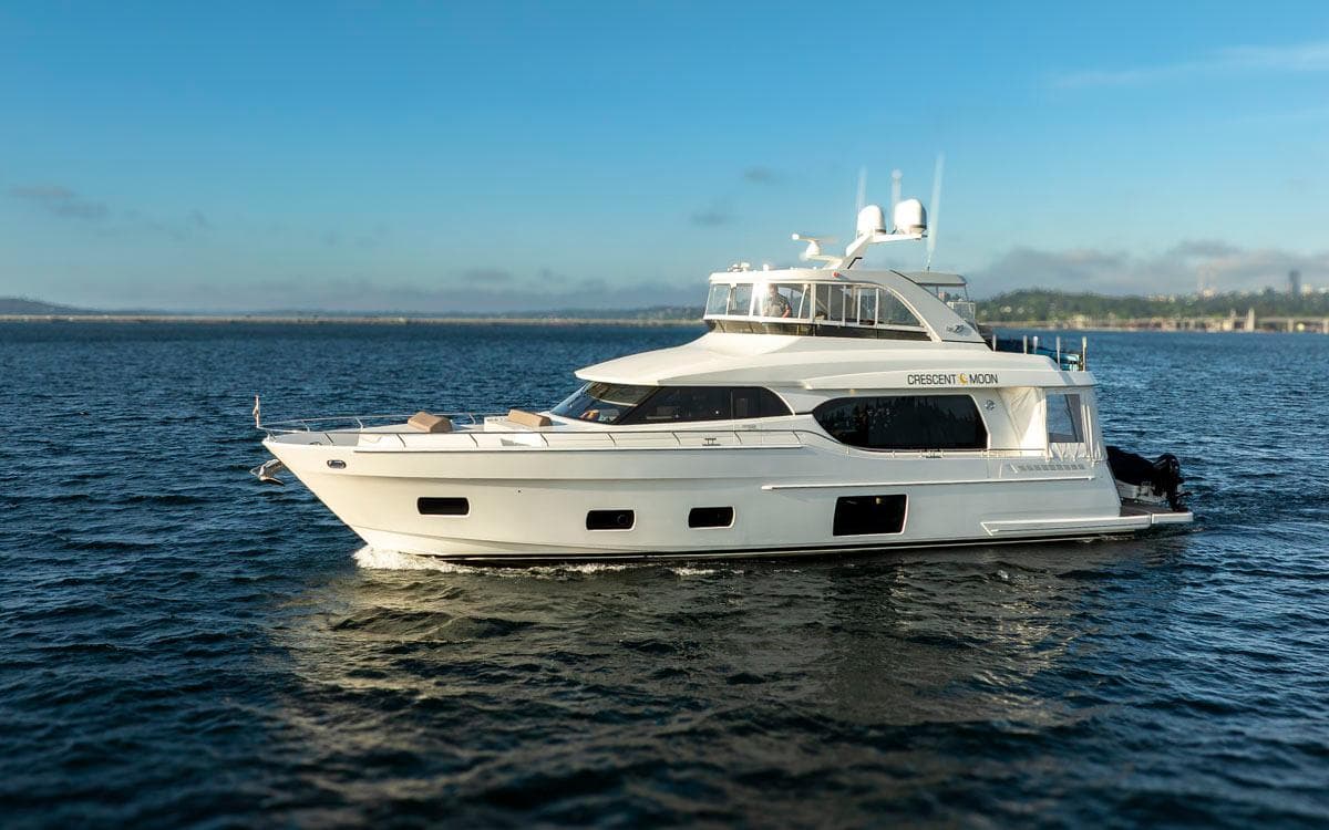 2017 Ocean Alexander 70E Motoryacht cruising on open water under clear skies.