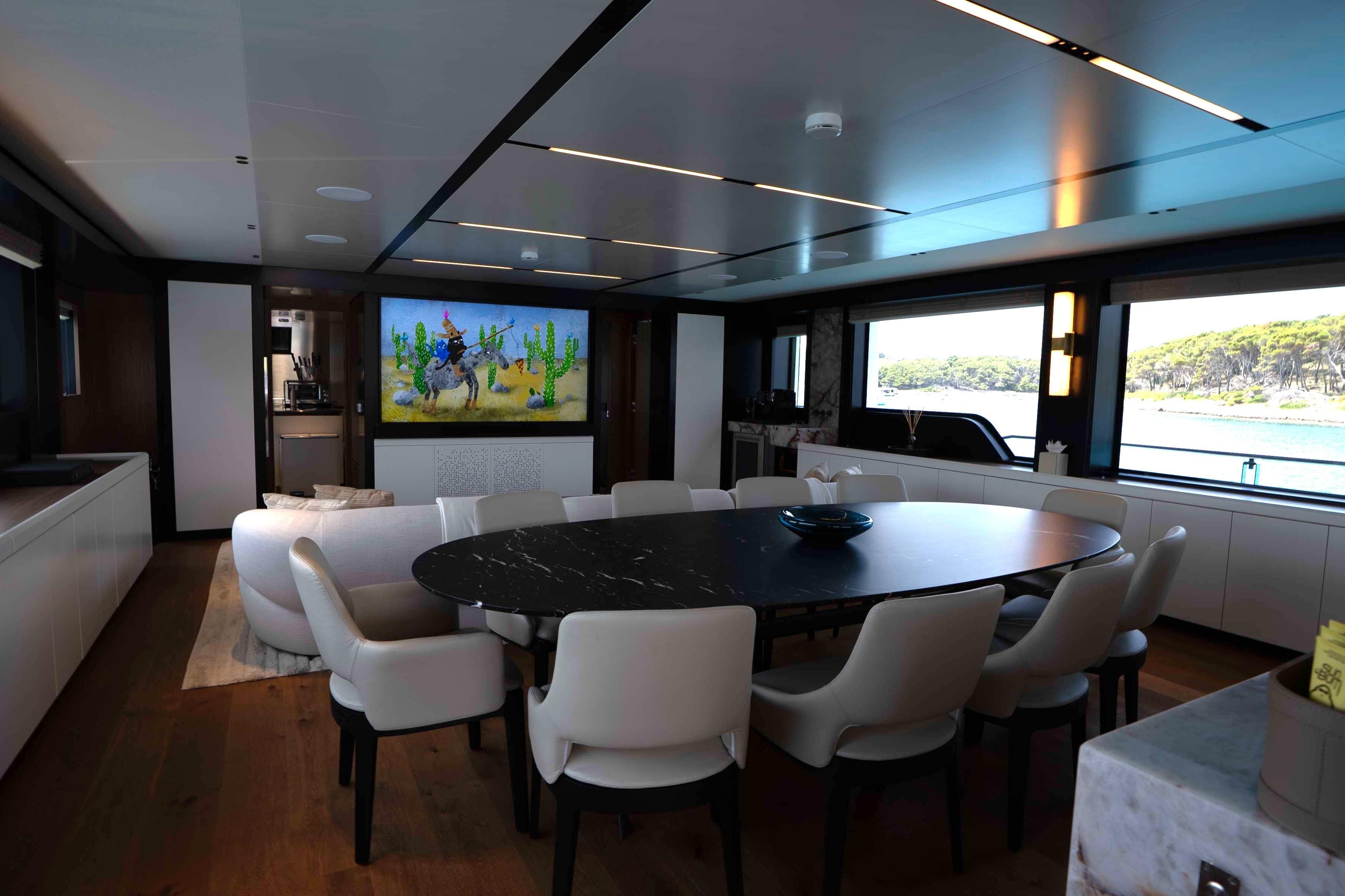 Luxurious interior of 2025 Alpha 100 Squalo Co Ownership yacht with elegant dining area.