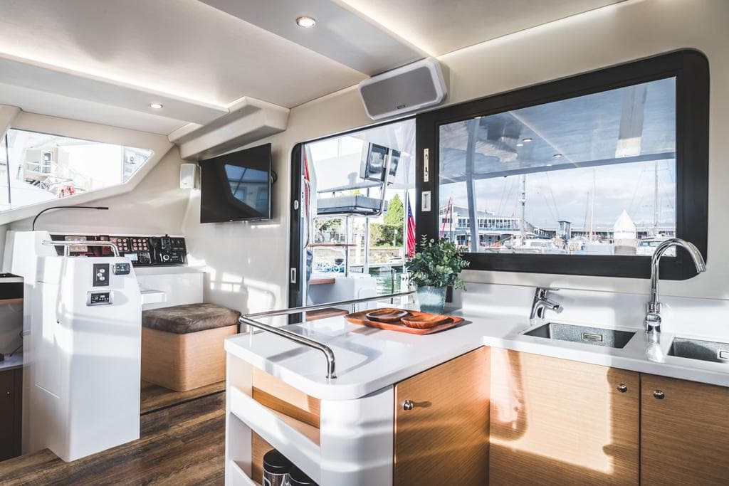 Modern Vision 444 yacht interior, featuring sleek kitchen and helm, 2026 model.