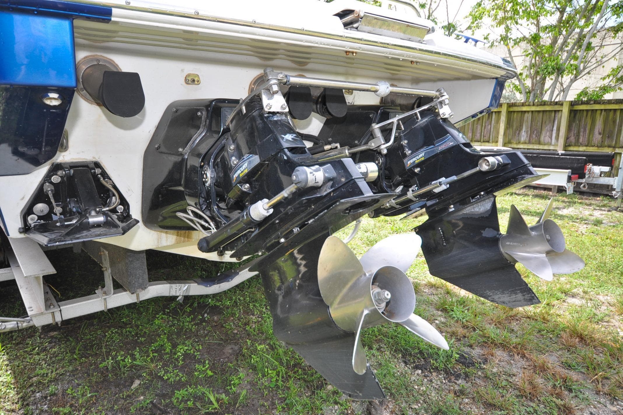 2006 Formula 382 FASTech boat with dual propellers and outboard motors.