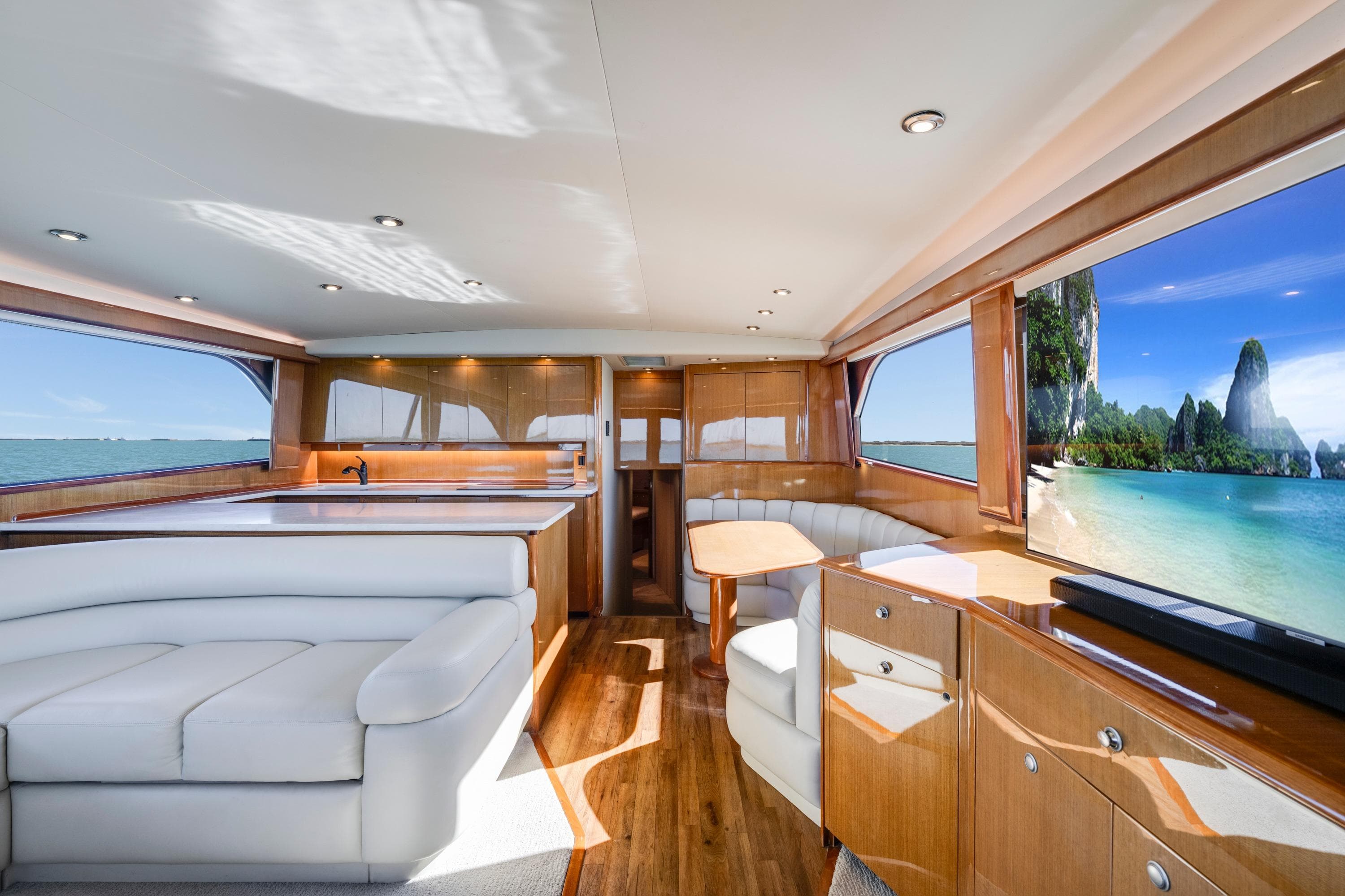 Luxurious interior of a 2002 Viking Convertible yacht with ocean view.