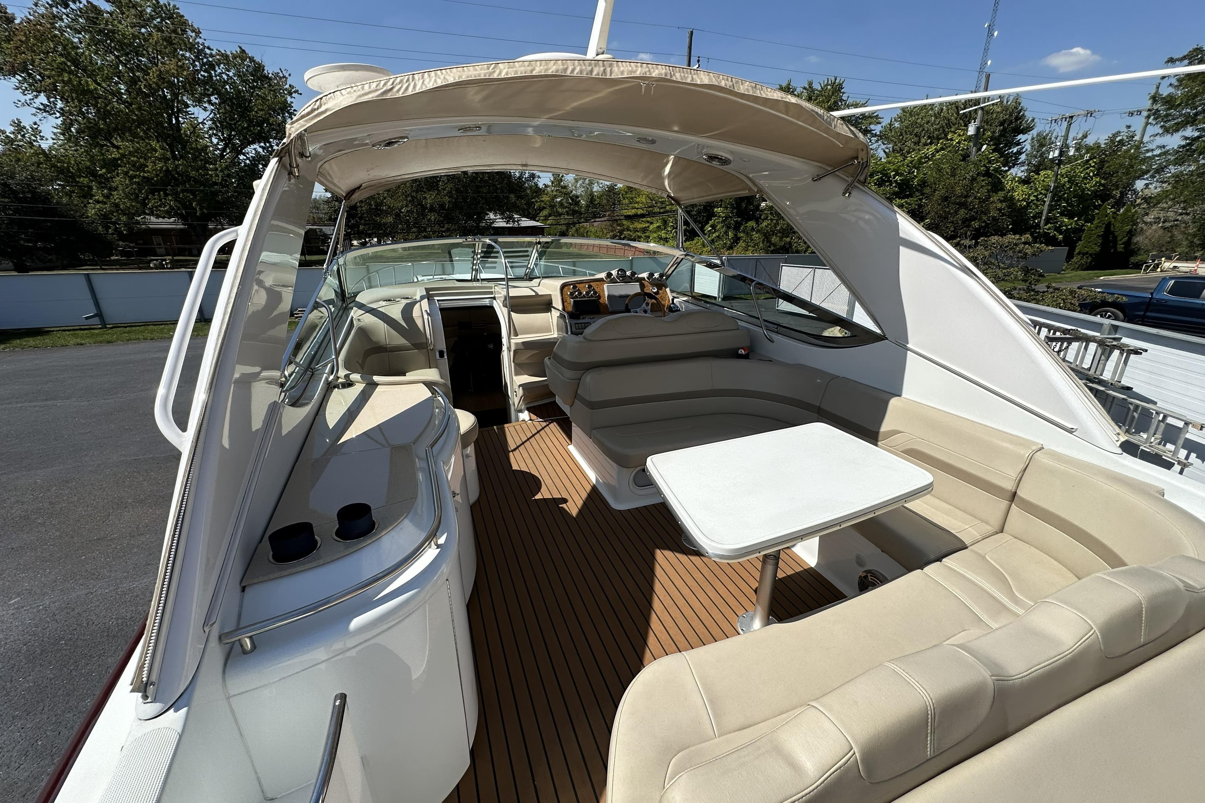 2011 Formula Yachts 40ss interior with beige seating and wooden flooring.