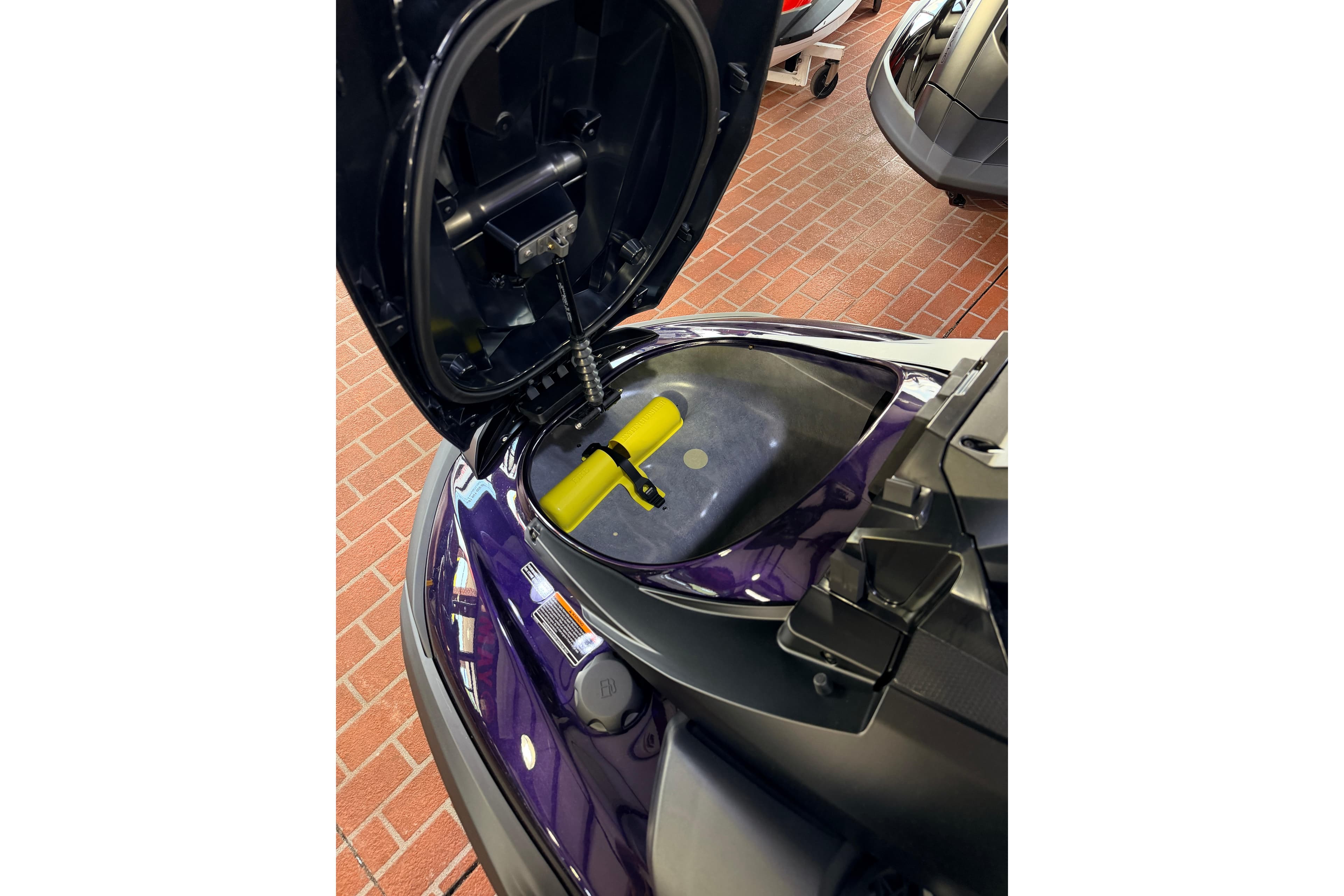 2026 Yamaha WaveRunner FX SVHO with open storage compartment on brick floor.