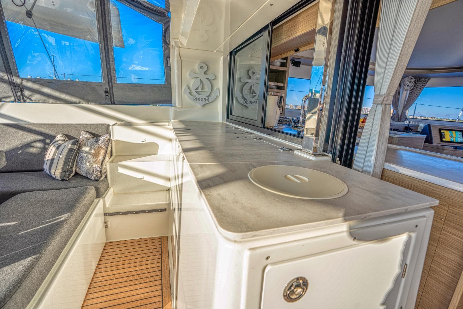 2024 Lagoon 46 yacht interior with modern seating and sleek design.