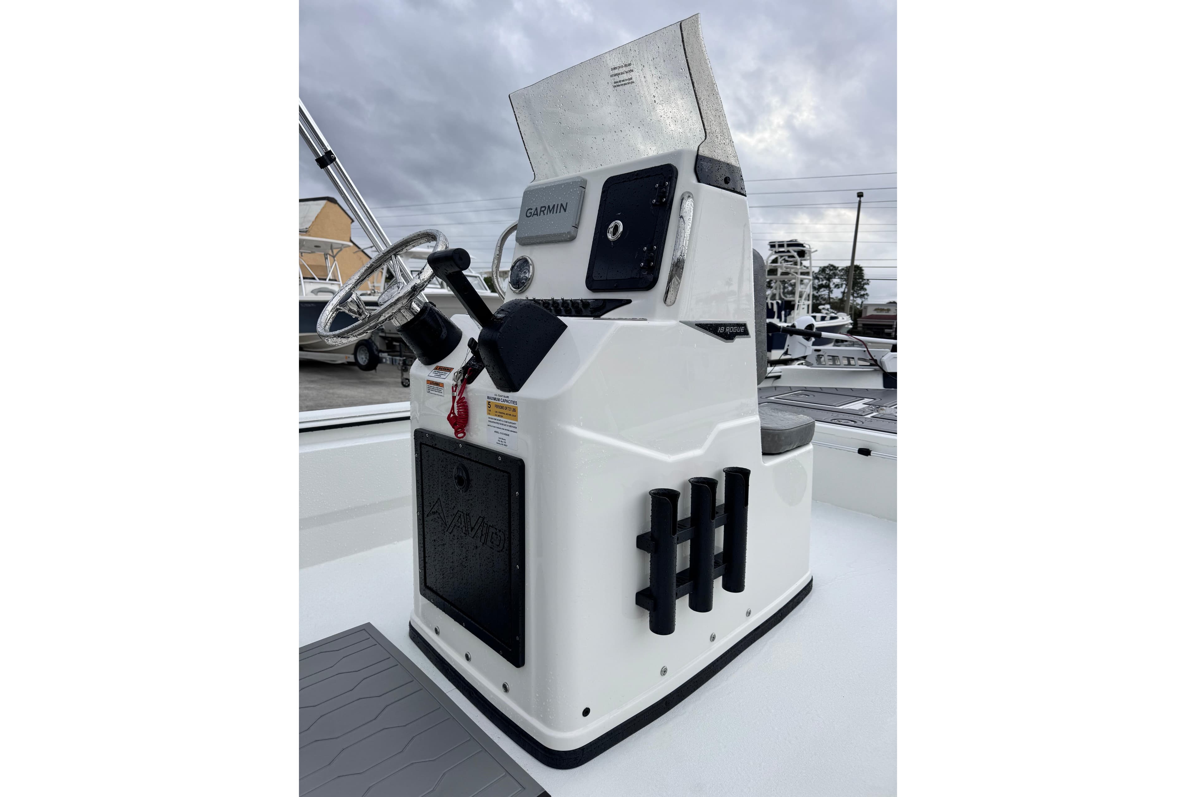 2026 Avid 18 Rogue CC boat console with steering wheel and Garmin display.