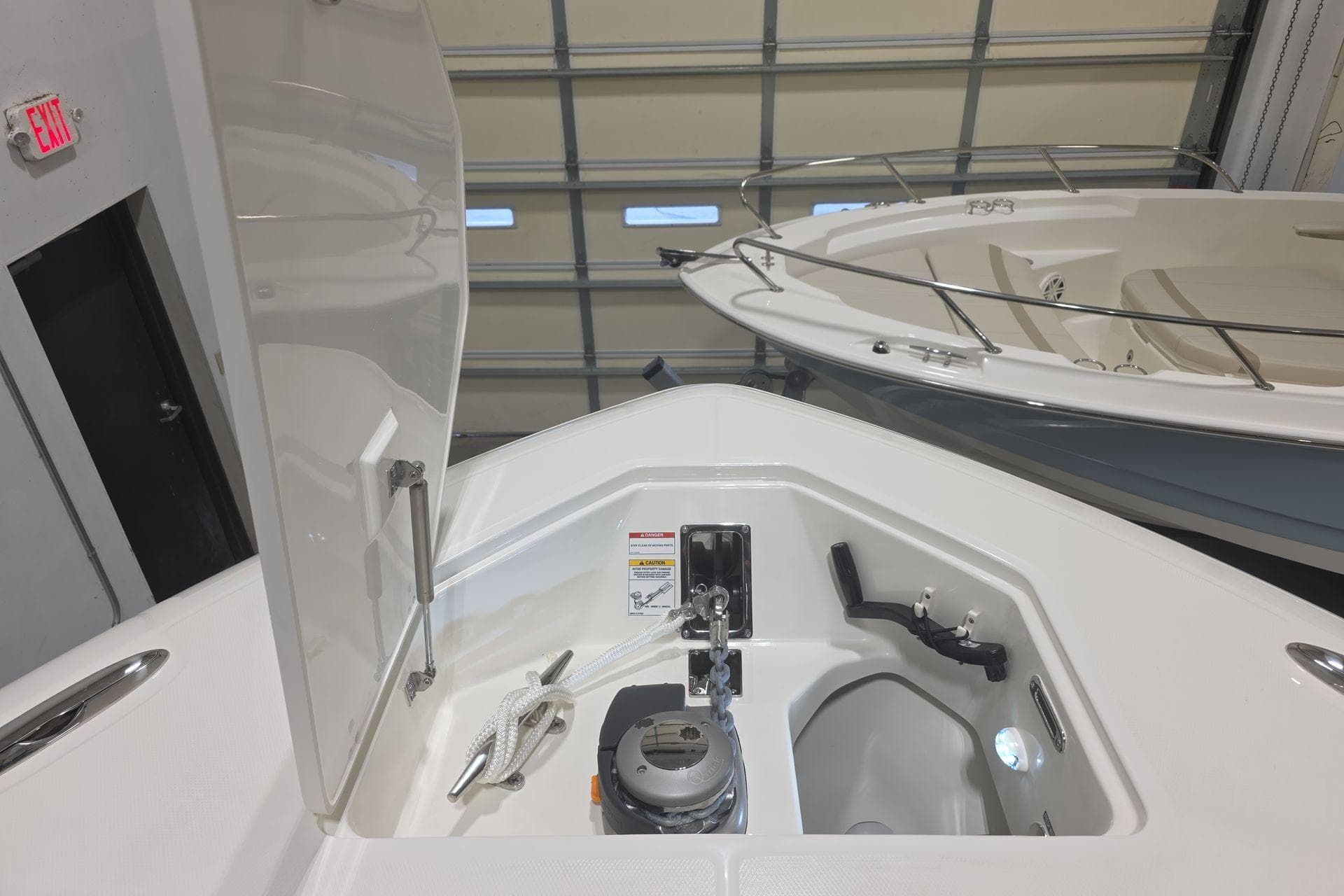 2026 Boston Whaler 380 Realm anchor compartment in a showroom setting.