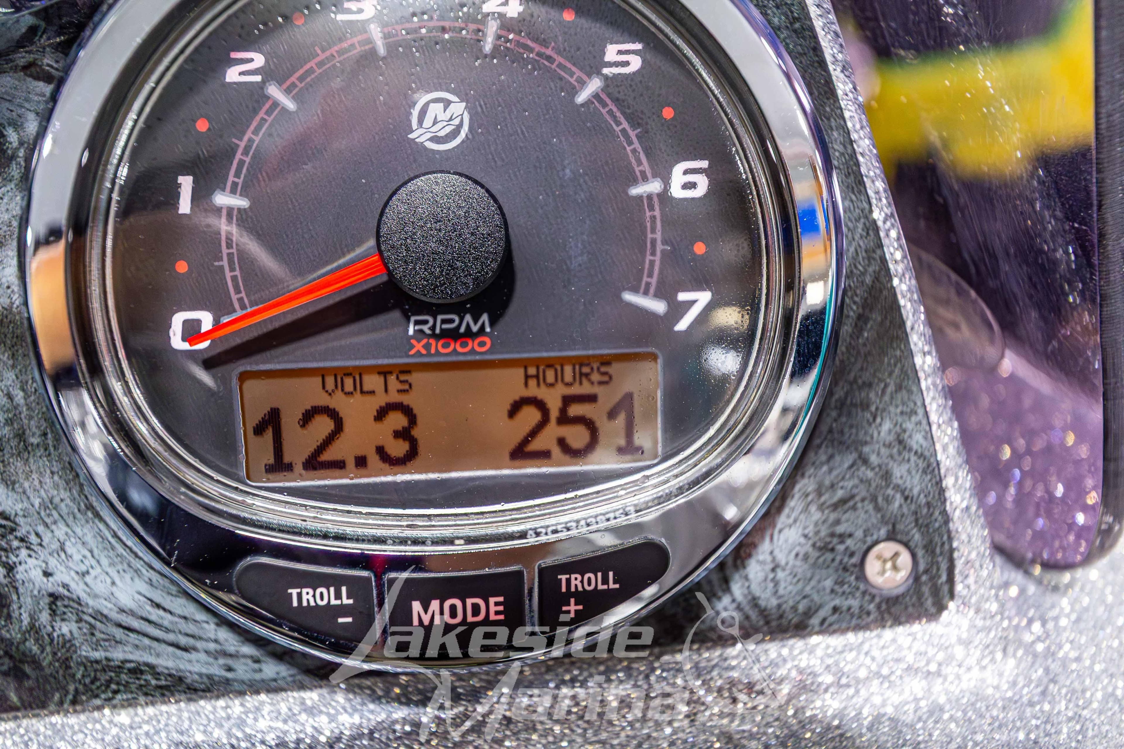 Close-up of a Recon 2185 SC 2019 tachometer displaying 12.3 volts and 251 hours.