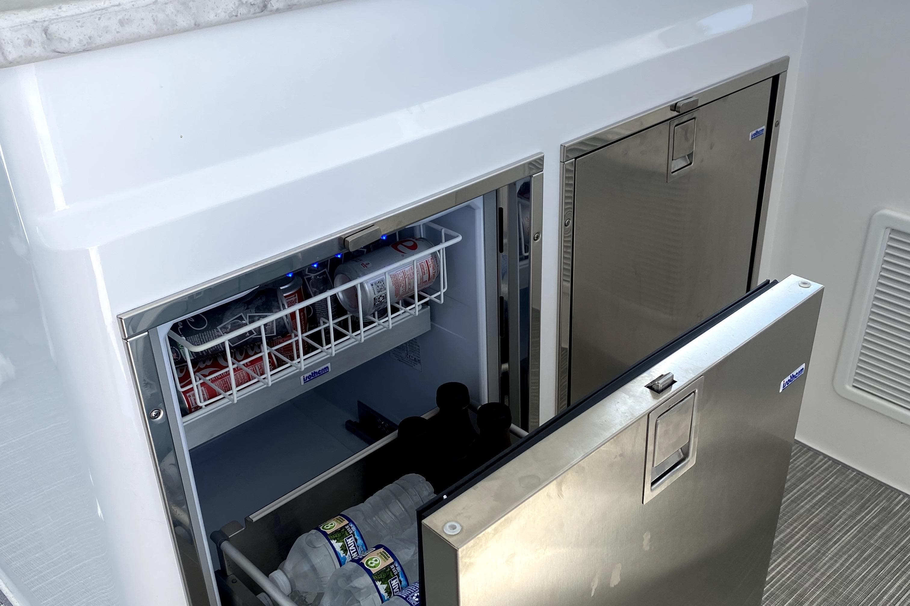 Intrepid 50 Evolution 2025 yacht refrigerator with drinks and storage.