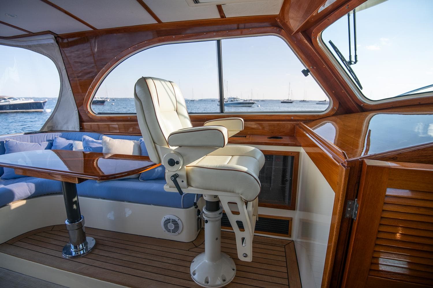 Luxurious interior of 2005 Hinckley Talaria 40 yacht with leather seating and wooden finishes.