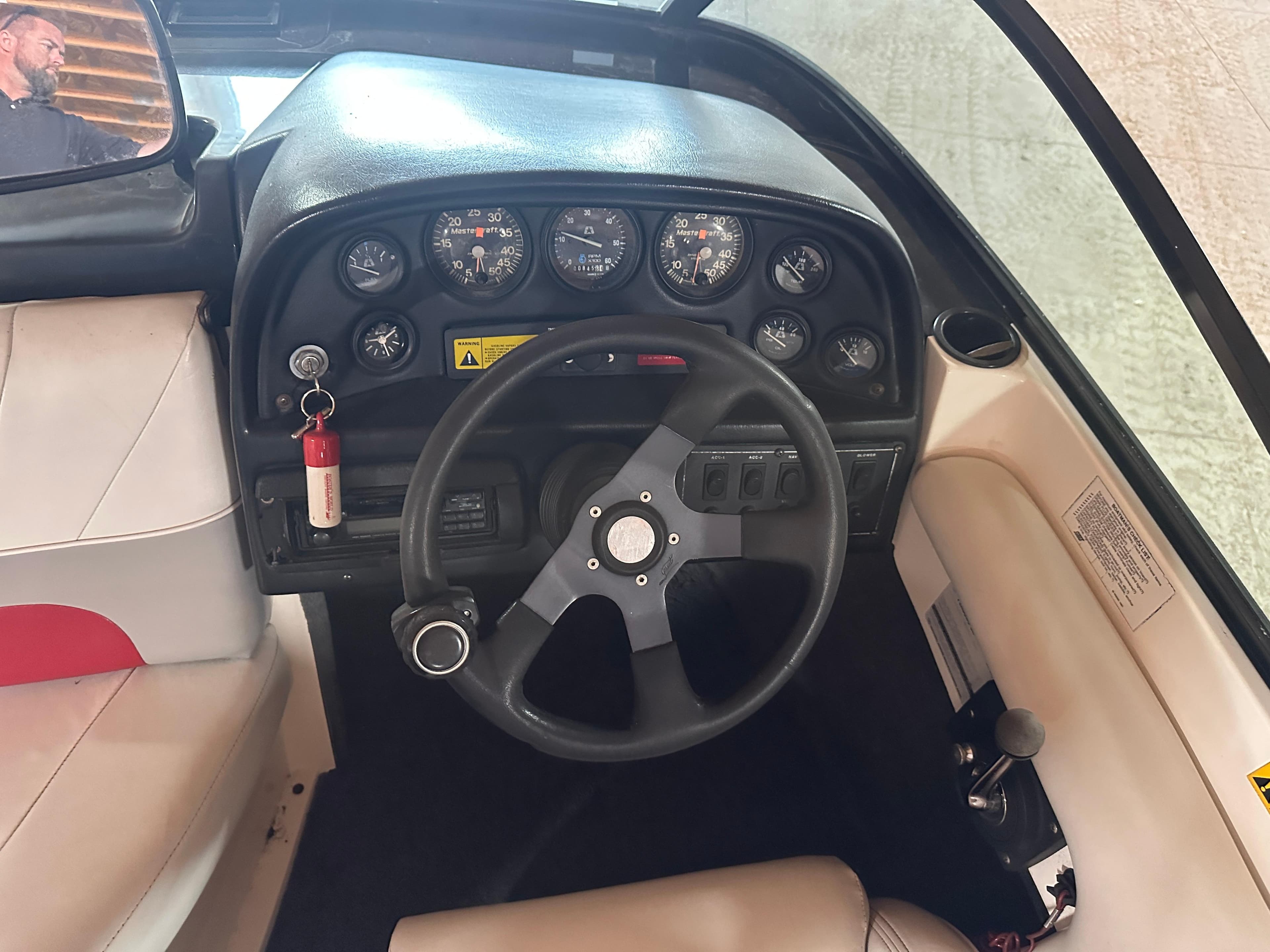 1993 MasterCraft ProStar 190 dashboard with steering wheel and gauges.