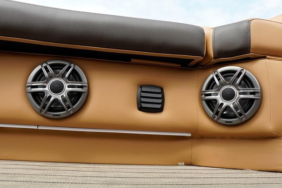 Speakers on SunCatcher Fusion 324RC boat, 2026 model, with tan upholstery.