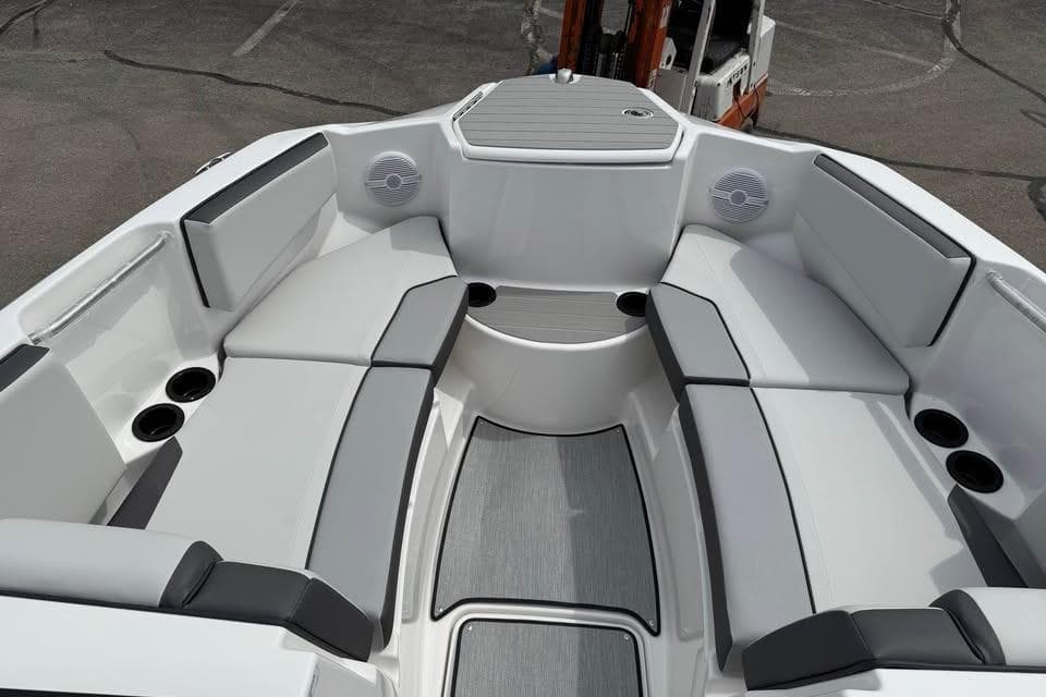 2026 Yamaha Boats AR220 interior with spacious seating and cup holders.