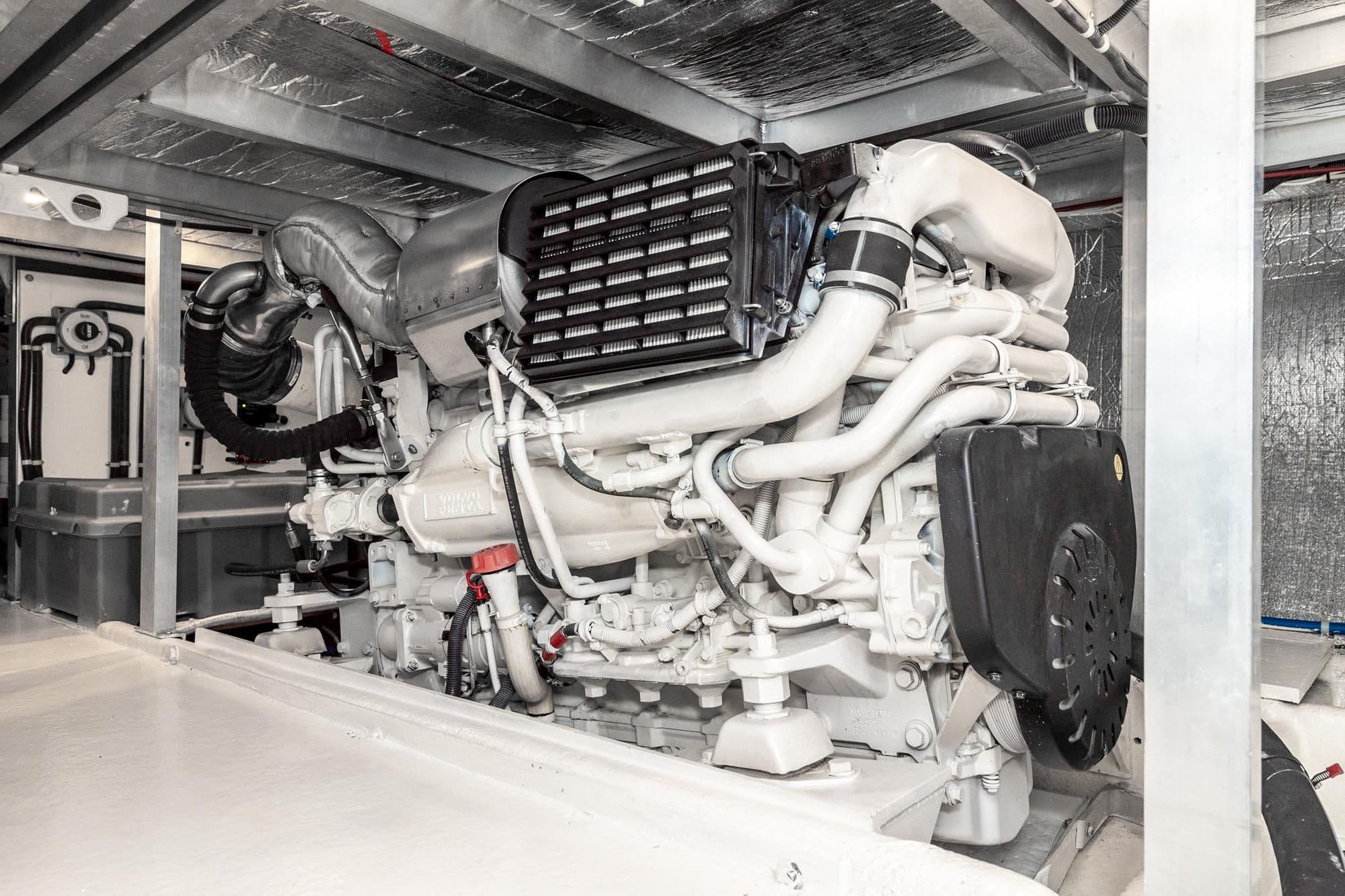 Engine room of 2006 Navigator 5100 yacht, showcasing a well-maintained marine engine.