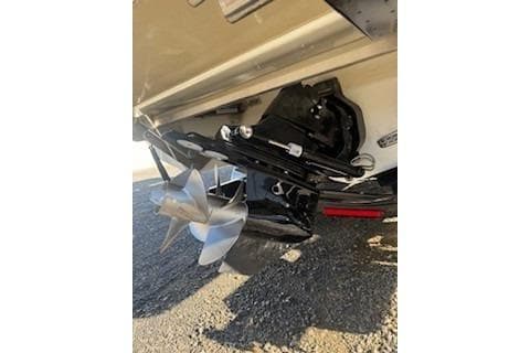 2018 Cobalt A28 boat propeller and stern drive on gravel surface.