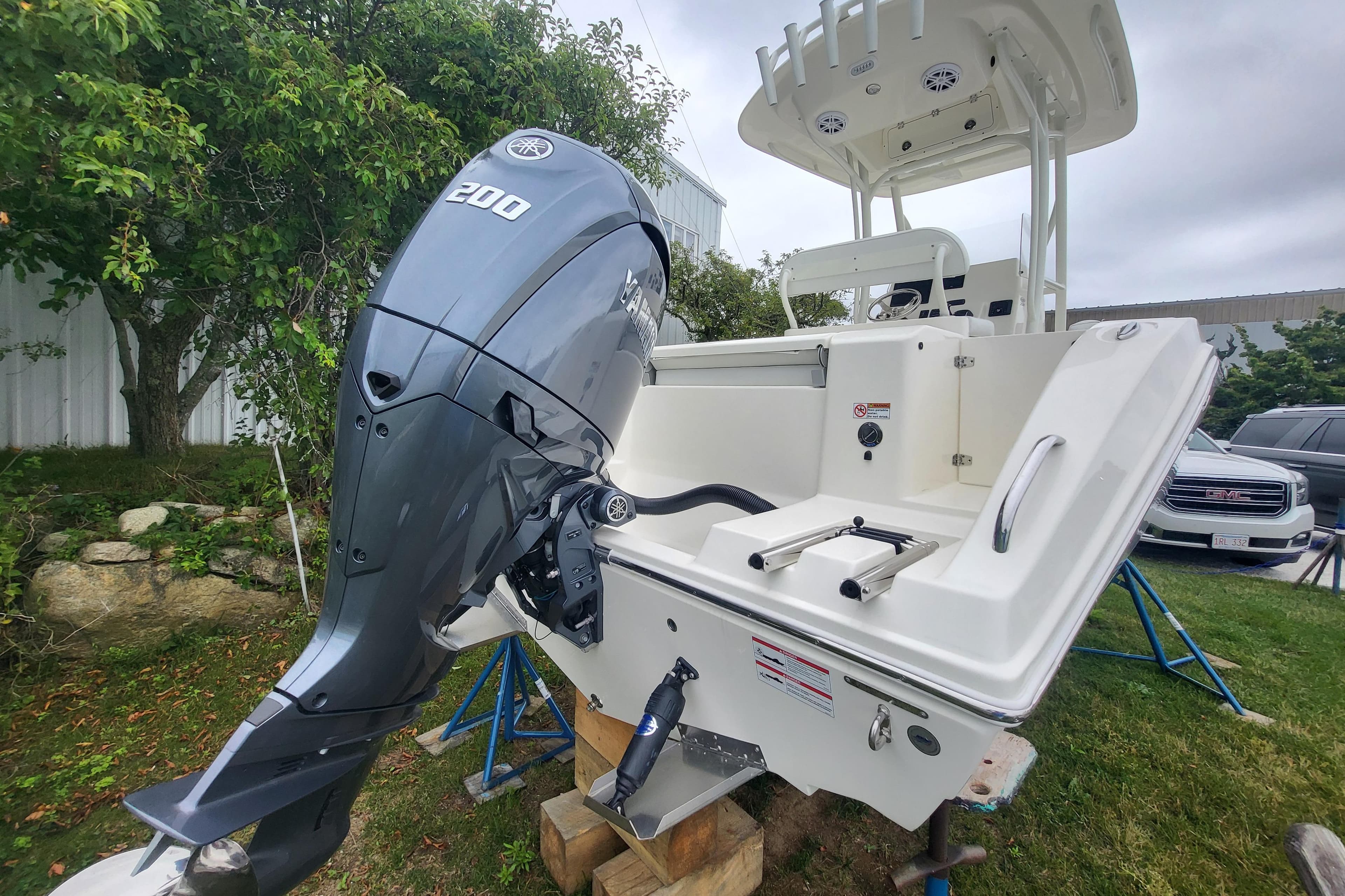 2025 Cobia 220 Center Console boat with Yamaha 200 outboard engine.